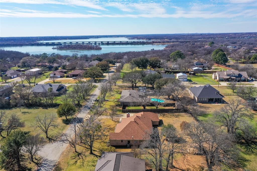 PRICE IMPROVEMENT! Experience the perfect blend of lake living, space, and freedom in this unique Hickory Creek property. Located just minutes from Lake Lewisville, enjoy easy access to scenic trails, boating, fishing, and outdoor recreation in a sought after golf cart friendly community.

Residents enjoy access to a private neighborhood marina with boat slips available exclusively to subdivision owners, along with a nearby public boat ramp for convenient days on the water.

Situated on a spacious half acre lot, this property offers the flexibility buyers are searching for with no restrictions on chickens, ducks, horses, or similar animals. Whether you dream of gardening, hobby farming, or simply having room to spread out, this property provides opportunities rarely found in traditional neighborhoods.

Inside, the home is designed for comfortable everyday living and entertaining with a whole home sound system and a private well that helps maintain a beautiful yard at a lower cost.

Conveniently located near I 35E, approximately 35 minutes from Dallas and 20 to 25 minutes from DFW International Airport, this home combines peaceful lakeside living with an easy commute.

If you have been searching for a home near the lake with land, flexibility, marina access, and room to enjoy the outdoors, this Hickory Creek property deserves a closer look.