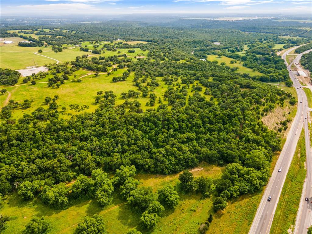 Introducing a picturesque property encompassing 75 acres of natural beauty and captivating features. Nestled within its expansive boundaries, this magnificent property boasts two enchanting ponds, an inviting elevation with breathtaking views, and lush pastures that create a harmonious blend of serenity and charm. The two ponds, enhance the overall allure of the landscape, offering a sense of tranquility and providing a perfect spot for fishing, or simply immersing yourself in the soothing sounds of nature. One of the standout features of this property is its elevation, which showcases sweeping views that stretch as far as the eye can see. With commanding views of the plateau's, sprawling meadows every day presents an opportunity to witness nature's ever-changing masterpiece. Additionally the property has a quaint frame house. This property provided road access from Ray lane and with 1820 foot Hwy 180 frontage.