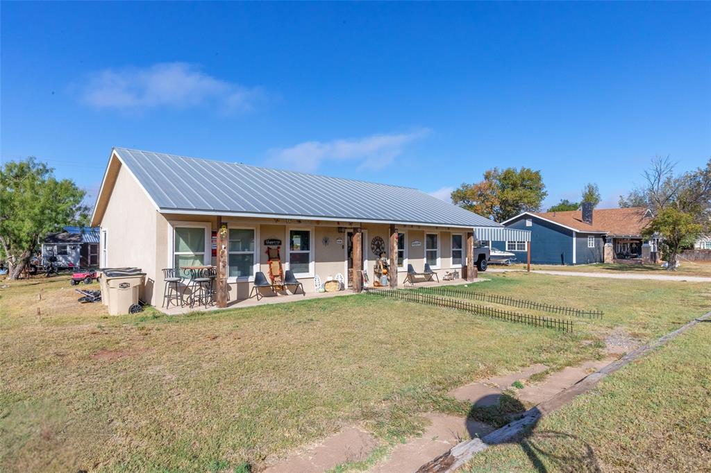 Welcome to 1502 Avenue N in Anson, Texas! Built in 2021, this 3 bedroom, 2 bathroom stucco home offers modern living, functional space, and small town charm just under 30 minutes from Abilene. Situated on a spacious corner lot, this property features a split bedroom floor plan, open concept living and dining area, and concrete floors throughout for easy maintenance and durability. The kitchen comes complete with appliances that will convey, creating a move in ready opportunity for the next owner. The primary suite offers privacy away from the secondary bedrooms, while the additional bedrooms provide flexibility for guests, office space, or hobbies. Outside, you’ll find a detached covered outdoor entertaining area, detached metal carport, storage shed, metal roof, and plenty of yard space with room to enjoy the outdoors. The large corner lot offers added parking flexibility and extra space compared to many homes in the area. Seller is offering a $5,000 buyer credit with an acceptable offer, which may be applied toward buyer closing costs or other allowable expenses with lender approval. Whether you are searching for a first home, investment property, or low maintenance newer construction in Anson, this property combines comfort, functionality, and convenience with easy access to Abilene and surrounding areas.