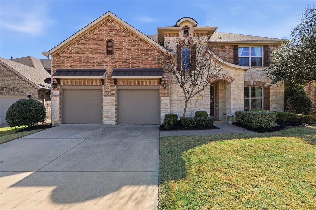 Perfectly positioned and gently lived in, this fully loaded 2018 former model home by Beazer Homes is a standout in the highly sought-after Trinity Falls community. Facing an open green space, the home captures exceptional natural light while offering a rare sense of privacy and serenity.
Impeccably cared for and thoughtfully designed, this two-story layout features 4 spacious bedrooms, 3.5 bathrooms, a private study, and a highly desirable in-law suite with its own ensuite bath. As a former model, it showcases premium upgrades throughout—an entertainer’s kitchen with an oversized island, granite countertops, double ovens, stainless steel appliances, and elevated designer finishes.  The upper level features a built in workstation and a fully customized media room with built in wiring and a kitchenette.
The primary suite is a true retreat with dual vanities, an expansive walk-in shower, and generous closet space. Cozy evenings by the fireplace and gatherings on the extended Texas-sized covered patio with an outdoor kitchen and range make this home as functional as it is inviting.
Residents enjoy resort-style pools, scenic trails, ponds, pickleball courts, clubhouses, fitness center, dog park, and vibrant community events. Zoned to brand new, top rated Frazier Elementary School and just minutes from the new Outer Loop, McKinney National Airport, premier shopping, dining - this is a rare opportunity to own a pristine, turnkey home where luxury, light, and location align.