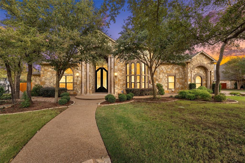Welcome to 8460 Spicewood Springs Rd., a breathtaking luxury estate in the highly sought-after Preserve at Bosque Bend. This exceptional property combines class, beauty, and elegance, offering a main house and a recently completed secondary residence, totaling 6,594 square feet of unmatched sophistication.
The main house spans 4,992 square feet, with four spacious bedrooms, four full bathrooms, a formal dining room, a home office, and an isolated upstairs theater with state-of-the-art sound carpeting and a three-quarter bath. Every inch of this home showcases premium craftsmanship, from the natural travertine flooring to custom faux paint finishes and exquisite knotty alder cabinetry throughout. Built by Loera Homes in 2011. Grand 12-foot Cantera wrought iron doors open to reveal stunning barrel ceilings, a massive stone fireplace, and top-tier GE Profile stainless steel appliances in the gourmet kitchen, making this a chef’s dream.
Perfect for entertaining, the outdoor living space features an oversized covered patio, a built-in grill and wet bar, and a sparkling heated pool with a tranquil 7-foot jacuzzi and cascading waterfall. The outdoor stone fireplace and lush landscaping create a serene retreat, ideal for relaxing evenings or hosting gatherings.
The secondary home, completed in 2023, adds 1,600 square feet of living space with two large bedrooms, two full bathrooms, and a convenient half bath accessible from the pool area. The open-concept kitchen and dining area provide a versatile addition for guests or family. Enjoy the 1,334 sqft garage, for the car enthusiast, off the casita with additional storage space.
From automated shades to the finest landscaping upgrades, no detail has been overlooked in creating this masterpiece. Move in, unpack, and enjoy the lifestyle you’ve always dreamed of – this home is truly turnkey and ready for its next discerning owner.