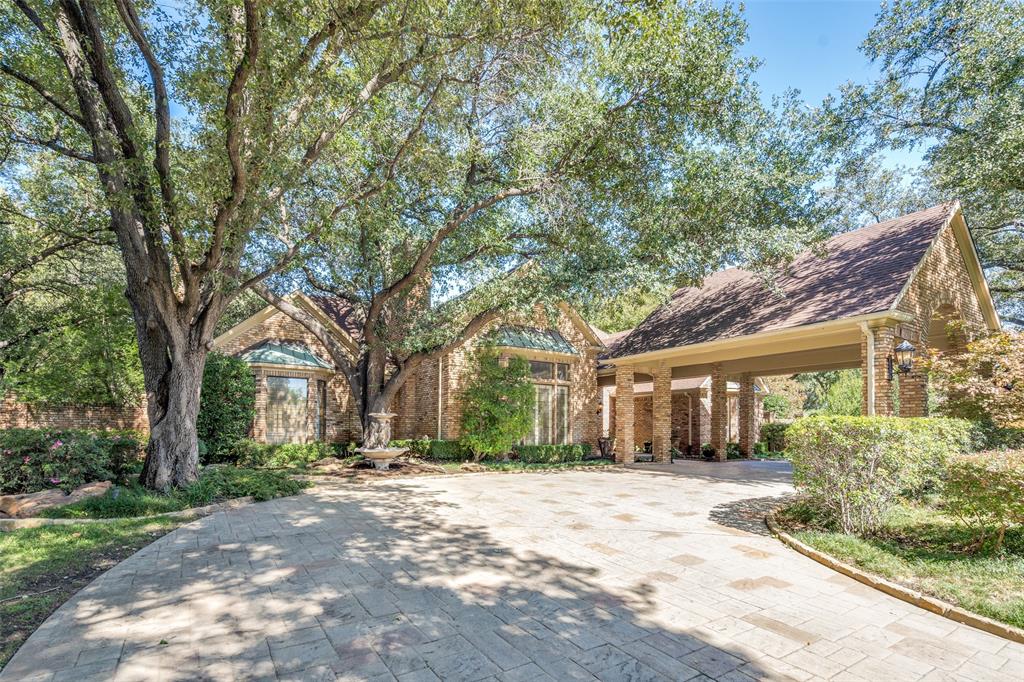 An exquisite 1.5 story home on heavily treed cul de sac lot. Beautiful covered front entry, hand scraped floors, high ceilings & timeless moldings.  Perfect for entertaining with the large living spaces and tasteful dining room. Enjoy the kitchen with large granite island, 6 burner flat cooktop, double ovens, warming drawer & breakfast bar. All bedrooms down. 5th bedroom could be an exercise room with dry sauna. Master with separate baths, steam shower and hydrotub. Upstairs takes you to a large media & game room with a sunken den.  The backyard is a highlight of the home.  A spacious yard with a covered patio, built in grill, stone fireplace, pool with a hot tub and a mosquito misting system to keep you comfortable.