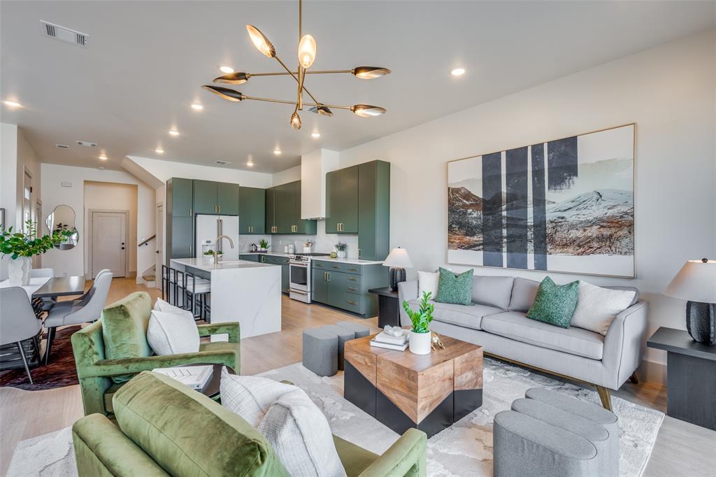 This stunning new construction townhouse in the highly desirable Dickies Arena area offers the perfect blend of modern luxury and unbeatable location in Fort Worth. Featuring 3 bedrooms and 2.5 bathrooms, this home boasts high-end finishes throughout, including sleek green tiled primary bath with a freestanding white soaking tub, seamless glass shower, dual vanities, and elegant gold fixtures; a gourmet kitchen with sage green cabinetry, expansive marble-look island, premium appliances, and seamless flow into the open-concept living and dining areas. The light-filled interiors showcase contemporary design with neutral tones, chic lighting, and large windows that invite natural light and connect seamlessly to outdoor spaces.

Step outside to your private amazing rooftop patio with breathtaking panoramic views of Dickies Arena right next door and the iconic Fort Worth downtown skyline—ideal for entertaining, morning coffee, or watching events and city lights. Additional highlights include a two-car garage, low-maintenance living, and prime proximity to the energy of Dickies Arena, cultural venues, dining, and easy access to major thoroughfares. Don't miss this rare opportunity to own a brand-new, turnkey townhome in one of Fort Worth's most exciting neighborhoods—perfect for those seeking style, convenience, and spectacular vistas!