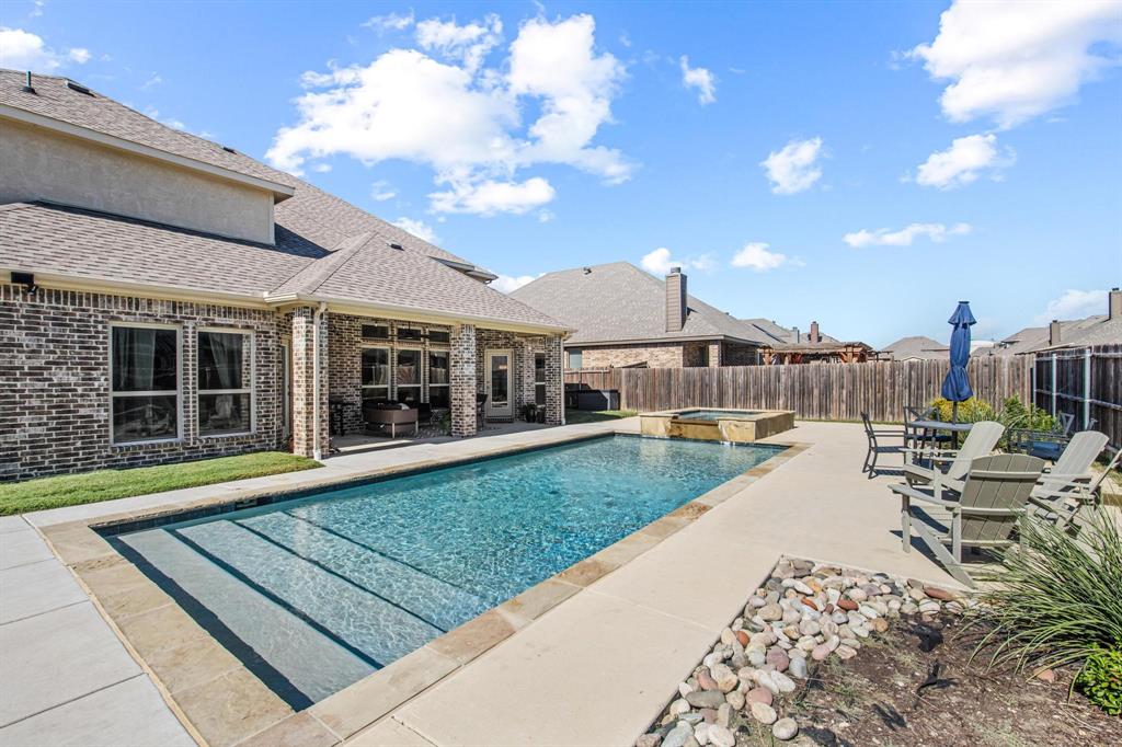 This exceptional 5-bedroom home offers the perfect blend of space, comfort, and entertainment. Designed with both everyday living and hosting in mind, the thoughtfully designed floor plan features a dedicated home office, formal dining room, formal living area, spacious family room, media room, and a playroom, providing flexibility for every stage of life.

Step outside to your private backyard retreat, where an extended covered patio overlooks a heated swimming pool and hot tub—perfect for year-round enjoyment. Whether you're hosting summer gatherings, enjoying family movie nights, working from home, or shooting hoops in the dedicated basketball area, this property offers something for everyone.

Located in highly regarded Red Oak ISD, this home delivers the space buyers crave with the amenities they dream about. From multiple living spaces to resort-style outdoor features, 104 Sweetleaf Drive is more than a home—it's a lifestyle.

Schedule your private tour today and discover all this incredible property has to offer.