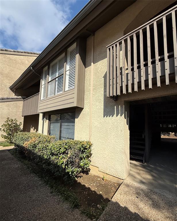 WOW!! PRICE IMPROVEMENT, SELLERS ARE MOTIVATED!! AMAZING 2 BEDROOM CONDO located in a highly sought after area on the edge of Los Colinas and close to shopping, entertainment venues and the DFW airport. This SPACIOUS condo on the second floor has vaulted ceilings, wood-look floors, plantation shutters, granite counters, custom tile, and so much more! The kitchen has been beautifully updated and offers a granite serving bar to the dining area. The massive living room has an adjoining balcony with lots of space for outdoor enjoyment. Both bedrooms have soaring ceilings and the oversized primary bedroom has a wall of windows overlooking the trees. The cozy second bedroom includes a private balcony perfect for a quiet reading area. The main bathroom has been renovated with a fantastic glass shower and includes a massive granite counter. Also offered in this incredible property is all the needed appliances including the refrigerator, washer and dryer. The condo complex is impressive as well with 2 pools, a club house, a weight room, and lush grounds with water features and tons of trees. Don't miss your chance to be the next lucky owners of this Quail Run condo!