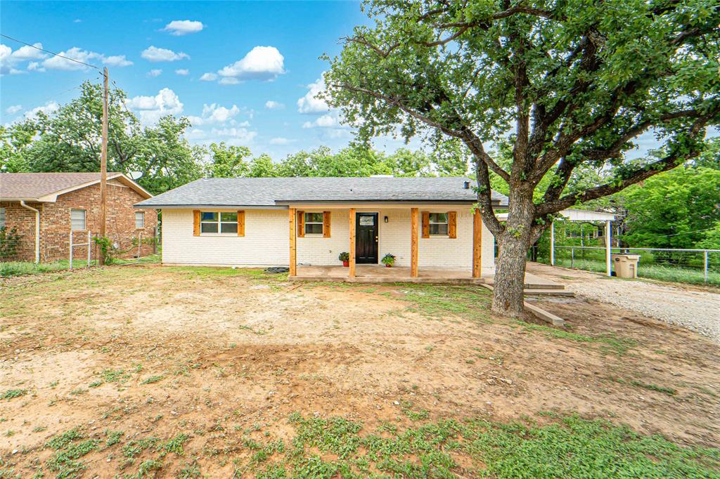 Beautifully remodeled waterfront home on Hubbard Creek Lake in Breckenridge, TX! This 1,376 sq ft home offers 2 bedrooms and 2 bathrooms with a fresh, modern feel throughout. Thoughtfully updated with neutral colors, new paint, fixtures, and lighting, this home is truly move-in ready. The open-concept layout features a spacious living area with a woodburning fireplace and large windows overlooking the lake. The kitchen showcases quartz countertops, all new appliances, and an island providing additional storage and workspace. Bathrooms have been fully updated with new vanities featuring quartz tops, along with updated fixtures and lighting. Bedrooms are spacious and comfortable, completing the inviting interior.
Exterior features include a workshop, metal storage building, and a metal covered patio down by the water, perfect for enjoying lake views. Property also includes a new boat dock, new septic system, new roof and is fully fenced for pets. Tastefully updated inside and out, this waterfront home offers the perfect blend of comfort, style, and lake living.