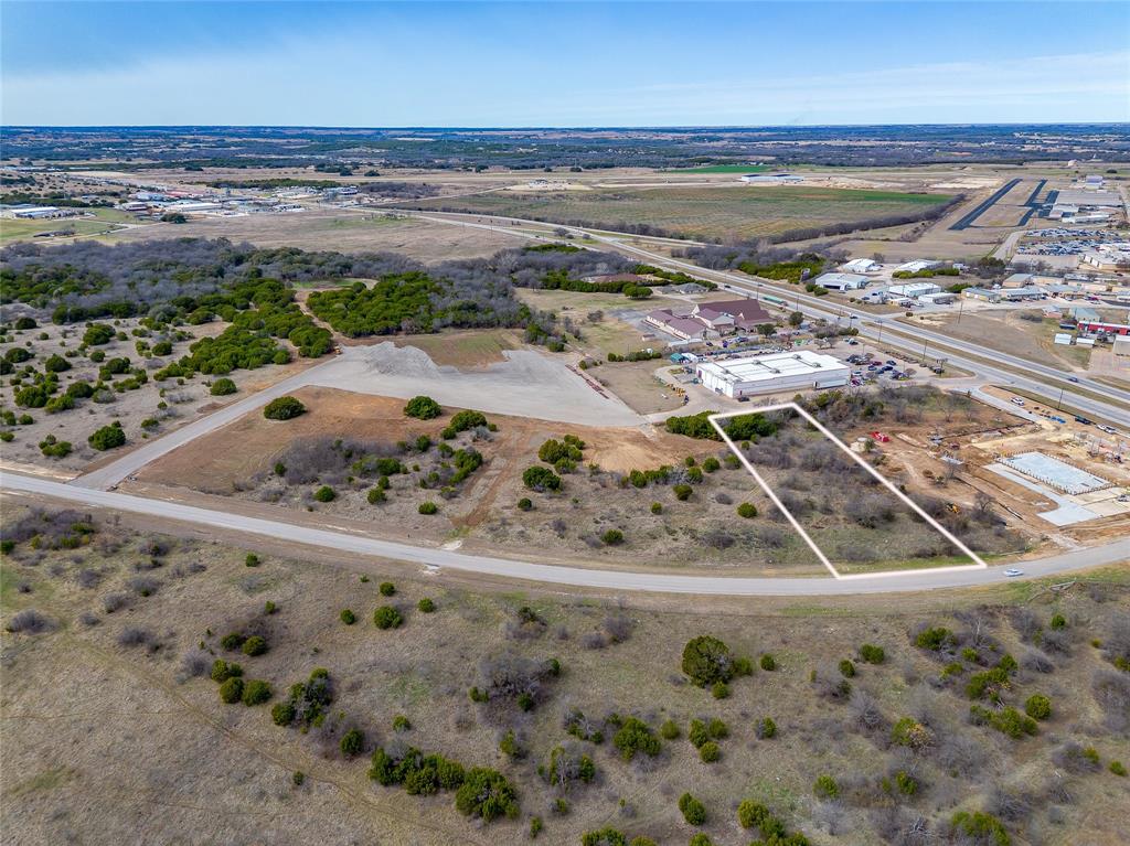 This property is ideally located in the heart of Granbury’s growing commercial corridor, next to 7-eleven, near Granbury Hospital, Granbury High School, multiple medical office buildings, and Granbury Regional Airport. Situated at the highly visible intersection of S. Pirate Drive and U.S. Highway 377, the site offers excellent exposure and accessibility. Utilities include sewer available at the front of the property, with access from both S. Pirate Drive and Highway 377, adjacent to the new 7 Eleven. The location and infrastructure make this site well suited for a variety of commercial uses, including medical office, retail, or service-oriented development (buyer to verify zoning and permitted uses). This is a prime opportunity in a rapidly developing area with strong traffic counts and surrounding commercial activity.