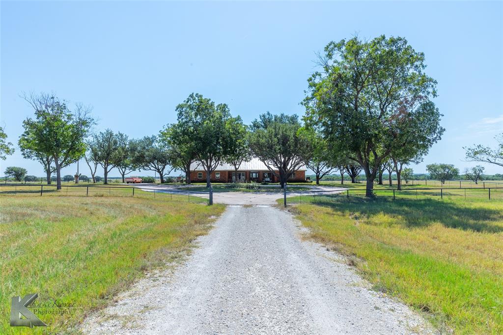 Welcome to 6401 Peppergrass Rd an exceptional 110-acre ranch in the heart of Wylie ISD, offering a rare combination of usable acreage, proximity to town, and move-in-ready amenities! The property features a spacious 2,767 sq ft ranch-style home, perfectly positioned for privacy and views. Ideal for ranchers, developers, or families looking for a homestead with room to grow.

This turnkey property includes a large barn, pipe fencing, working cattle pens, corrals, and coastal grass pastures that produce quality hay. It’s fully equipped with a water well, county water meter, and overhead electric, making it ready for livestock, expansion, or development.

Rolling topography and scenic views create multiple ideal homesites, while the current setup supports agricultural use today and long-term investment tomorrow. Whether you envision a working ranch, a family estate, or future subdivision, this land delivers value and versatility.

Located just minutes from Dyess Air Force Base, Hendrick South Hospital, and all major Abilene amenities, you’ll enjoy the peaceful feel of the country without sacrificing convenience. Properties of this size and setup in Wylie ISD are rare—don’t miss the chance to own this piece of West Texas.