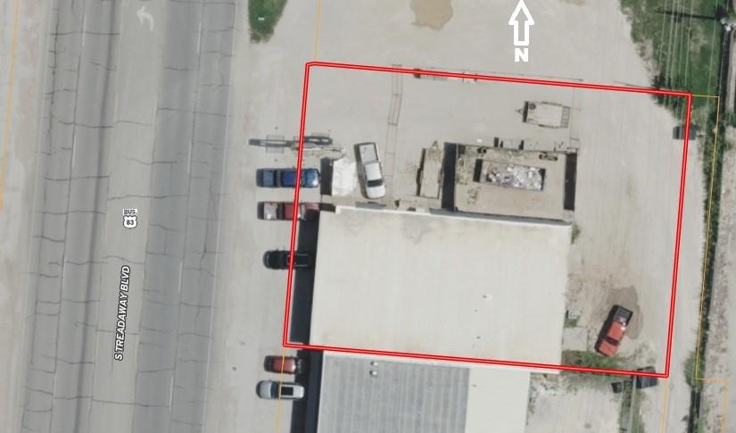 INVESTMENT PROPERTY. This property is currently fully leased. One lease expires at then end of October in 2028. The other lease expires at the end of february of 2031. Both businesses seem to be content in their locations. Indications are they may want to renew. Both units have parking in the front of the building and space in the back of the building for parking or loading. The space to the north, 917 S Treadaway has a fenced area for material storage as well as a little additional parking.