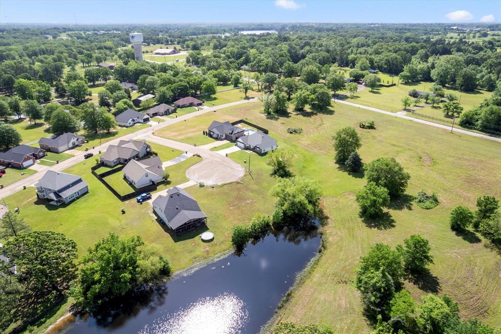 Waterfront Lot – Northwood Subdivision, Mount Pleasant, TX

Rare opportunity to build your custom home on a 0.46-acre vacant residential lot in the desirable Northwood Subdivision. This property backs up to a lake, providing added privacy and tranquil natural views with no rear neighbors. Located in a quiet, well-maintained neighborhood with build-to-suit flexibility. Utilities available at the street. Convenient access to schools, shopping, dining, and just minutes from Lake Bob Sandlin. No HOA.