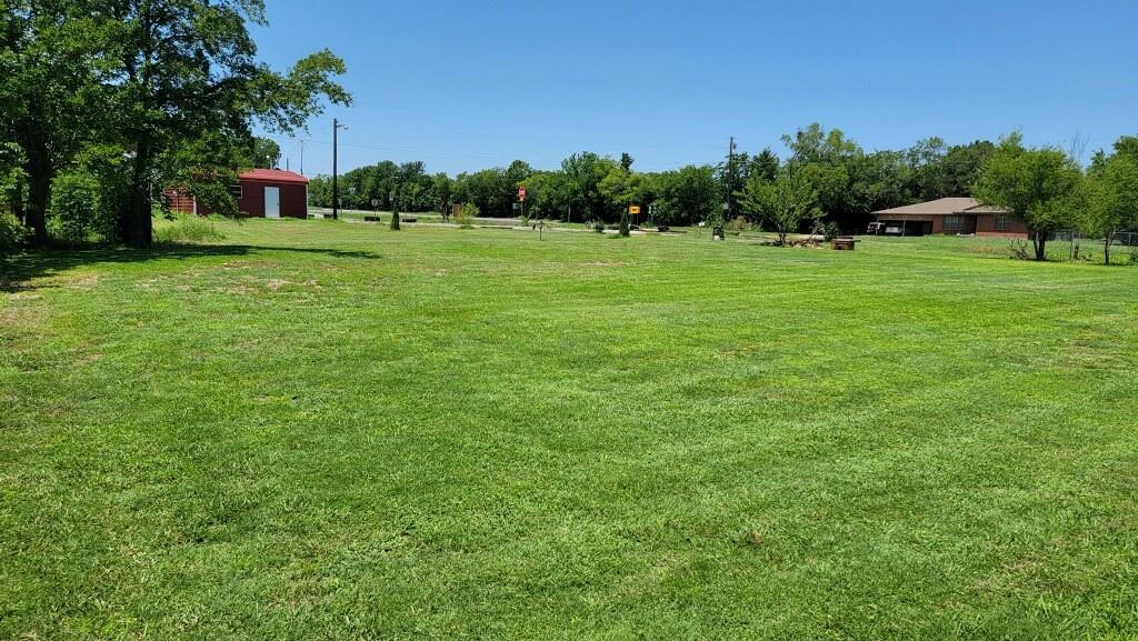 Rare and unique opportunity to build your business and home on adjoining lots with great visibility for your business! There is a considerable amount of traffic on both FM roads daily! This lot has road frontage on E FM 120. This listing is to be sold along with MLS# 20266816, parcel #112395 only! 
.696 Acre with road frontage on FM 120. Metal shop-warehouse building was built in 2021. Shop-warehouse building is on concrete slab with electricity. According to the Oak Ridge South Gale Water Supply Corp., a water meter was purchased in the past but never installed. The new owners will only need to pay a $50 membership fee transfer from the current owner and install the water meter at their convenience.