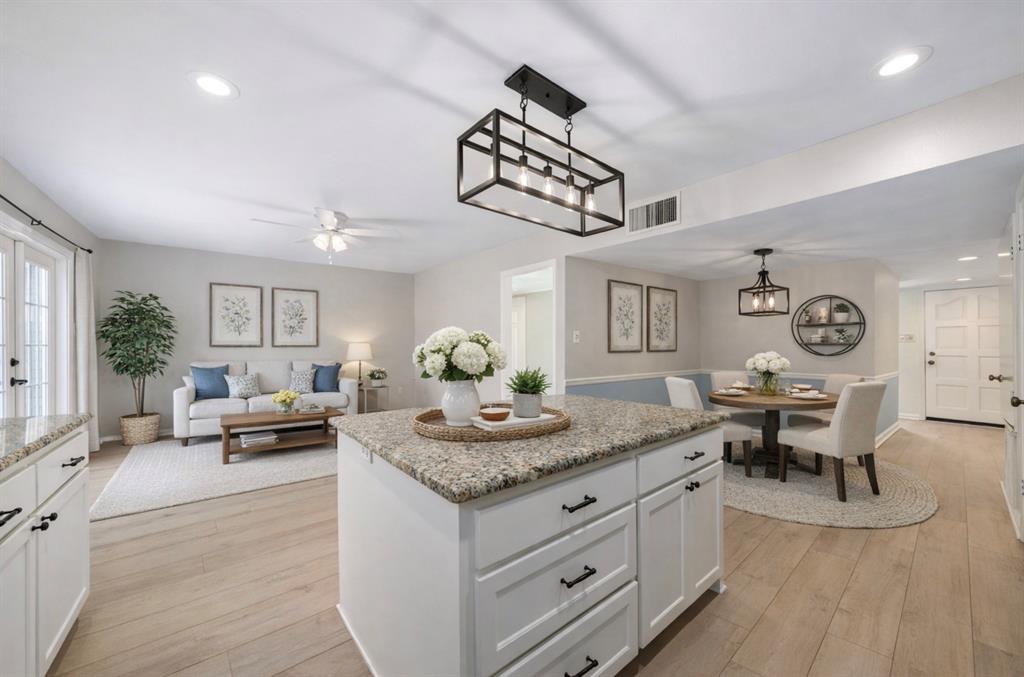 Updated and move-in ready! This beautiful single-story home in Coppell offers a light-filled interior, stylish finishes, and a functional open-concept layout. The gorgeous updated kitchen features crisp white cabinetry, granite countertops, a classic herringbone backsplash, black hardware and fixtures, generous counter space, eat-in breakfast area, and kitchen island overlooking a second living area; a perfect layout for everyday entertainment and enjoyment. Wide-plank wood-like vinyl flooring and soft neutral tones flow through the main living spaces. The spacious family room showcases a brick fireplace and opens seamlessly to the formal dining area and kitchen. French doors lead to a nice back patio, covered patio, and oversized backyard with plenty of room to relax, entertain, or play and for pets. With attractive curb appeal and thoughtfully updated interiors, this home is ready to enjoy and offers quick access to dining and shopping! New sprinkler system front and back. New windows (previous owners had replaced a few, current sellers replaced others) Virtual tour and colored floorplan available!
