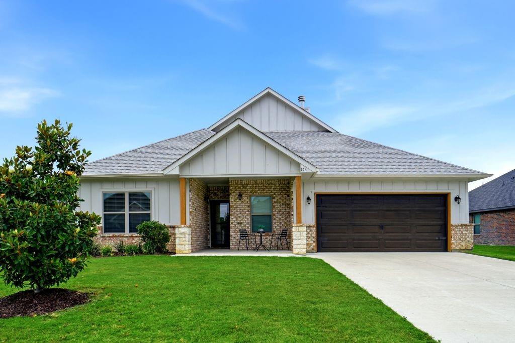 One-story home built in 2022, set on a 0.24-acre lot. The plan offers 3 bedrooms, 2 full baths, a separate office, and a 2-car attached garage. The open-concept living, dining, and kitchen area includes a center island, granite countertops, and custom cabinetry. A split-bedroom layout places the primary suite apart from the secondary bedrooms. Interior features include a stone wood-burning fireplace, window coverings, and a utility room sized for a full washer and dryer. Built-in stainless steel kitchen appliances include an electric range, electric oven, dishwasher, disposal, and vented exhaust fan. Outdoor features include a covered patio with a patio extension (20x22), an awning, and a sprinkler system.