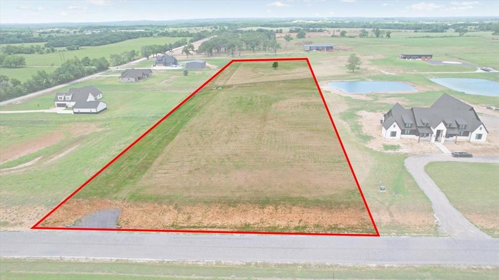 Escape to peaceful country living on this beautiful 4.86 acre tract located on the west side of Whitesboro in the desirable Club Lake Ranch development. Featuring a gently rolling slope and scenic views, this property offers the perfect setting to build your custom dream home while enjoying the quiet charm of rural living with the convenience of town just minutes away. Enjoy an ideal location just a short drive to Lake Texoma for boating, fishing, dining, and outdoor recreation, while also being a short drive to the Dallas–Fort Worth metroplex, WinStar World Casino and Resort, Choctaw Casino & Resort, and Megastar Casino. Club Lake Ranch deed restrictions help preserve the beauty and value of the community while still allowing flexibility for country living. Barndominium style homes are permitted, with a minimum of 1,800 square feet for the primary residence. Horses are allowed on lots over 4 acres, and shops or barns may be added after construction of the main home.  This acreage combines space, location, and lifestyle in one exceptional property.