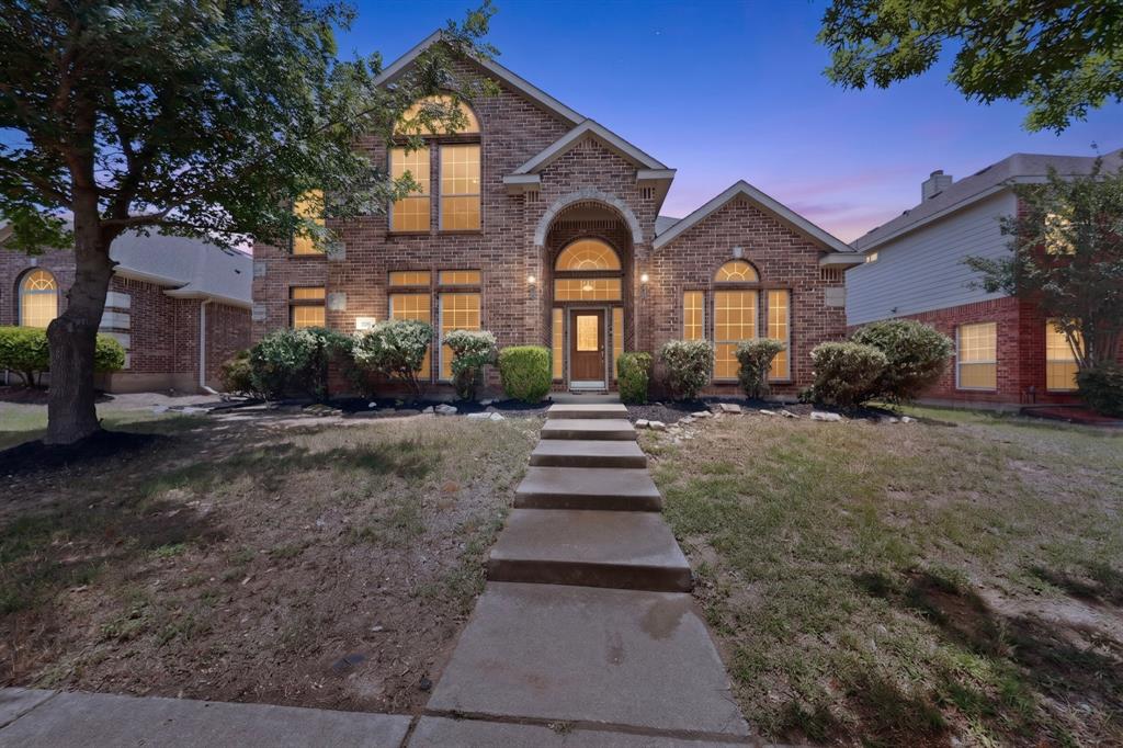 Beautiful brick and stone two story home offering 4 bedrooms, 3 full baths, 2 half baths, a private study, formal dining room, and spacious game room. The inviting living area features soaring ceilings, abundant natural light, and a cozy wood burning fireplace. The island kitchen is equipped with granite countertops, a gas cooktop, double ovens, ample cabinetry, and a sunny breakfast area. The oversized primary suite is conveniently located on the first floor and includes a sitting area, dual vanities, a soaking tub, separate shower, and a large walk in closet. Upstairs, you'll find generously sized secondary bedrooms and a versatile game room. Additional highlights include hardwood flooring, a covered patio, fenced backyard, and attached 2 car garage. Located in the desirable Harmony community with easy access to shopping, dining, and major commuter routes. Schedule your private showing today! Some images in this listing have been virtually staged.