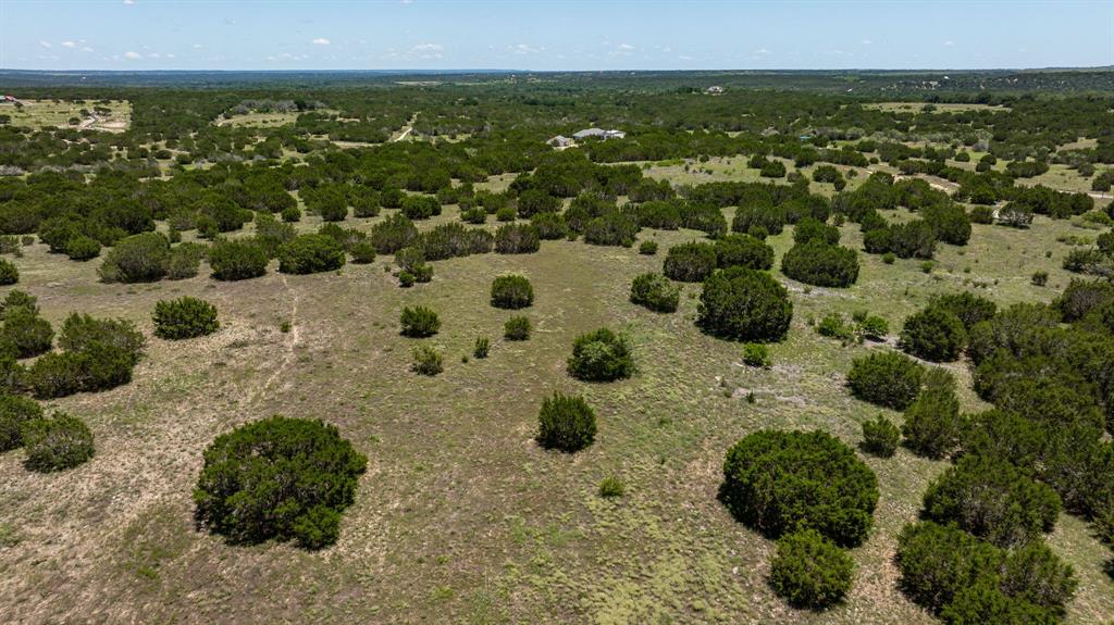 Qwner Financing available -Spectacular views surround the 15 acres with scattered trees throughout the property. This property just minutes from Hamilton and Cranfills Gap would be a great weekend getaway or a permanent residence. There's electric and internet   It's AG exempt.