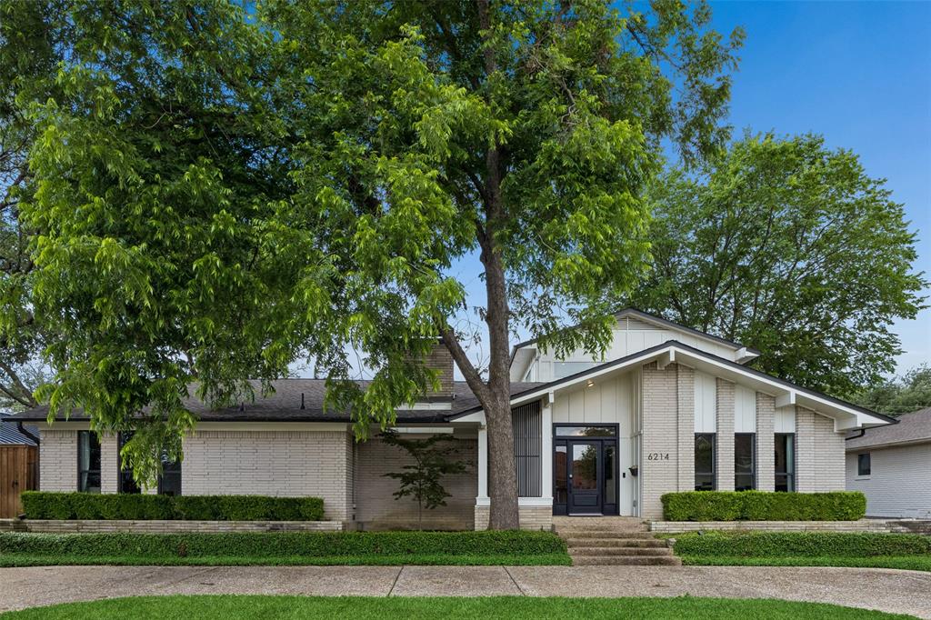 Nestled on a beautifully landscaped lot in the desirable Lovers Lane East neighborhood, this home delivers exceptional style, thoughtful design, and effortless everyday living. Surrounded by mature trees and enhanced by impressive curb appeal, this stunning residence offers an inviting blend of modern sophistication and comfortable functionality across a spacious, well-designed floorplan. Step inside to discover light-filled interiors highlighted by rich hardwood floors, soaring vaulted ceilings, skylights, custom millwork, and elegant architectural details throughout. The expansive main living area creates a warm and welcoming atmosphere with a beautiful fireplace, walls of windows, and seamless flow for both everyday living and entertaining. The open-concept layout connects beautifully to the dining spaces and gourmet kitchen, where a large center island, abundant cabinetry, gas cooking, double ovens, and a walk-in pantry create a space as functional as it is stylish. The thoughtfully designed first-floor primary suite serves as a private retreat with generous proportions, a sitting area, spa-inspired bath with dual sinks, soaking tub, separate shower, and an oversized walk-in closet. An additional downstairs bedroom with ensuite bath and dedicated study provide flexibility for guests, work-from-home needs, or multigenerational living. Upstairs, spacious secondary bedroom and an additional living area create the ideal setup for family and guests. Designed for year-round enjoyment, the backyard offers a true outdoor oasis. A sparkling pool with water feature, covered patio spaces, and beautifully landscaped surroundings create an ideal setting for relaxing evenings or entertaining friends and family. Ideally positioned in East Dallas with convenient access to dining, shopping, parks, and everyday amenities, this home presents an exceptional opportunity to enjoy refined living in one of the area's most sought-after neighborhoods.