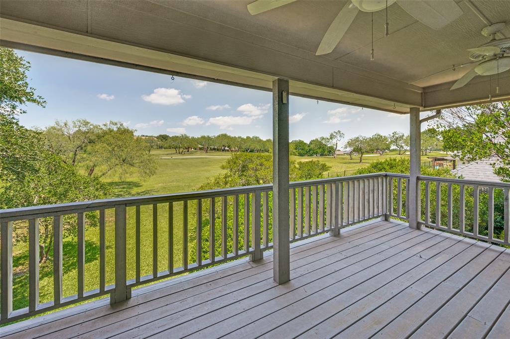 Rare find! Gorgeous views of hole #17 of the Ben Hogan Course at Trophy Club. This lovely Trophy Club home offers 3 bedrooms, 3 bathrooms & an oversized 2 car garage. Trophy Club is currently the #1 safest city in Texas. Freshly painted walls throughout. There is a wall of windows in the living & dining room. The living room offers cabinets, a wet bar & a wood burning fireplace. One bedroom downstairs with a full bathroom, 2 Bedrooms & 2 full bathrooms upstairs.  Spacious primary bedroom with an en-suite and access to the balcony. The kitchen has granite countertops, a ton of cabinets & a pantry. There are 2 ovens, 2 cooktops & microwave. Relaxing covered patio in the backyard. Low maintenance yard. Sprinkler System. Walking distance to golf course and Trophy Club Country Club.
Two Community Pool, Golf, Greenbelt, Jogging Path, Bike Path, Park, Playground, Tennis Court