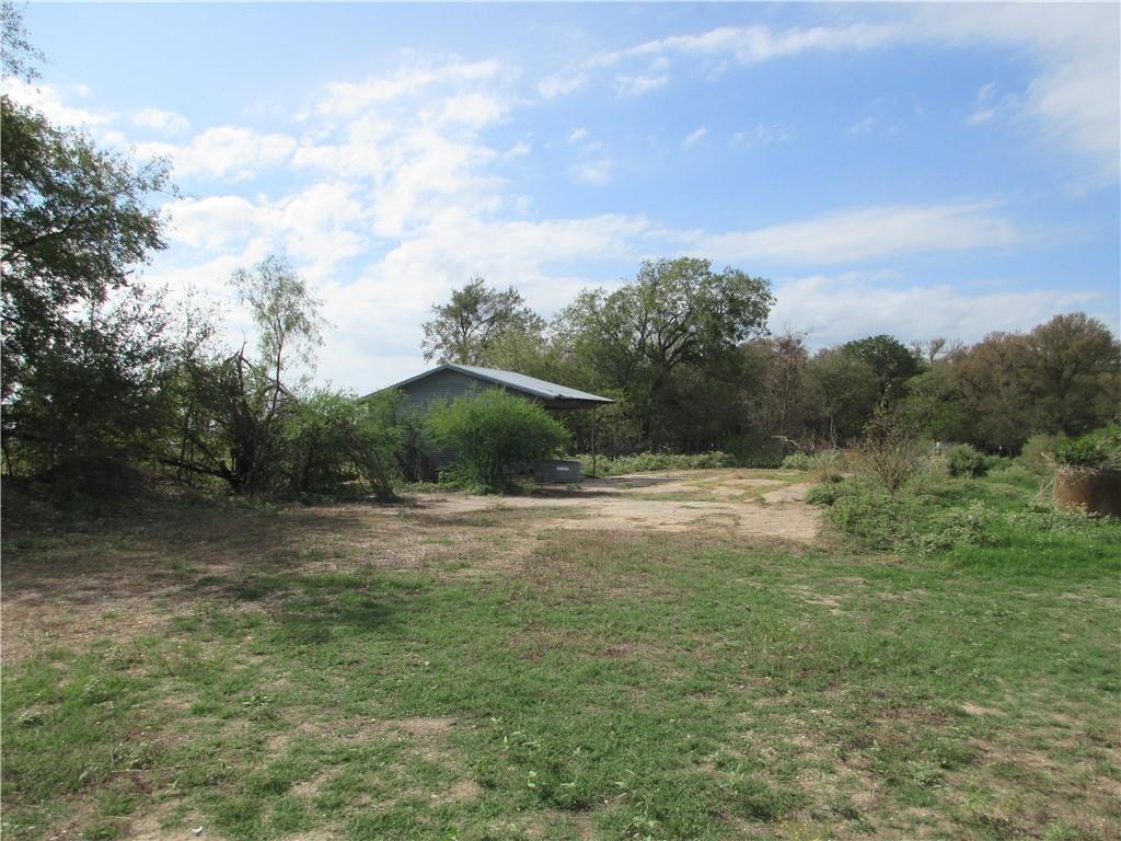 Great Place to build your home. Two open lots which includes a 2" water line, washout area and storage building.  Water is provided by Tri-County SUD.