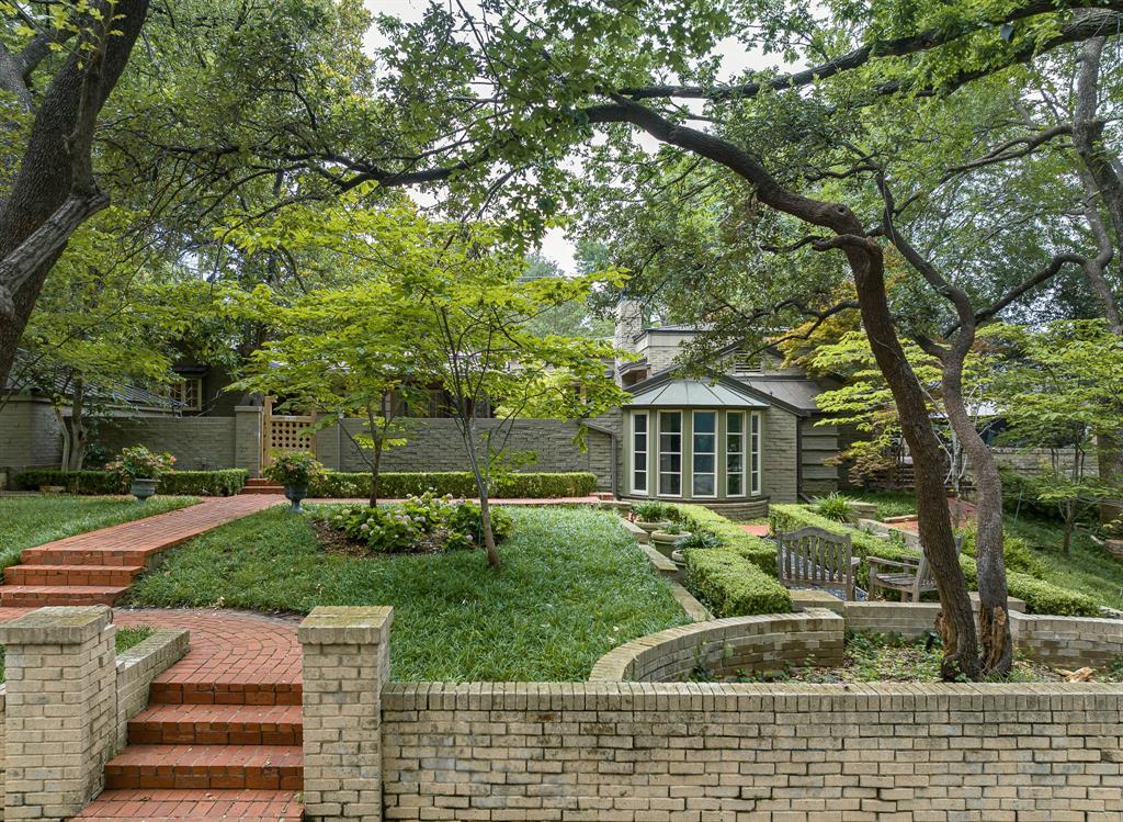 Designed by architect Charles Dilbeck, this residence has been expanded over the years to offer a generous 3,858 sq. ft. of living space on an oversized 125 x 140 ft. terraced & landscaped lot with mature trees. Step through a charming gate to the spacious courtyard and front door. Enter a sun filled entry & sitting room that expands to the sky lit, commercially outfitted kitchen and vaulted den designed by Frank Welch that overlooks a private patio & fountain. The adjoining dining room is large enough to seat a crowd. The 3 bedrooms are placed to ensure maximum privacy, each with its own bath. The primary bath is a true retreat with wonderful features including duel closets. The office has distinctive rounded corners and bookshelves. For a cozy change of pace, step into the original living room complete with bookcases and inviting fireplace. Expansive east terrace offers tranquil views. Favorably located half a block from UP Elementary, & close to Snider Plaza, UP pool, and parks.