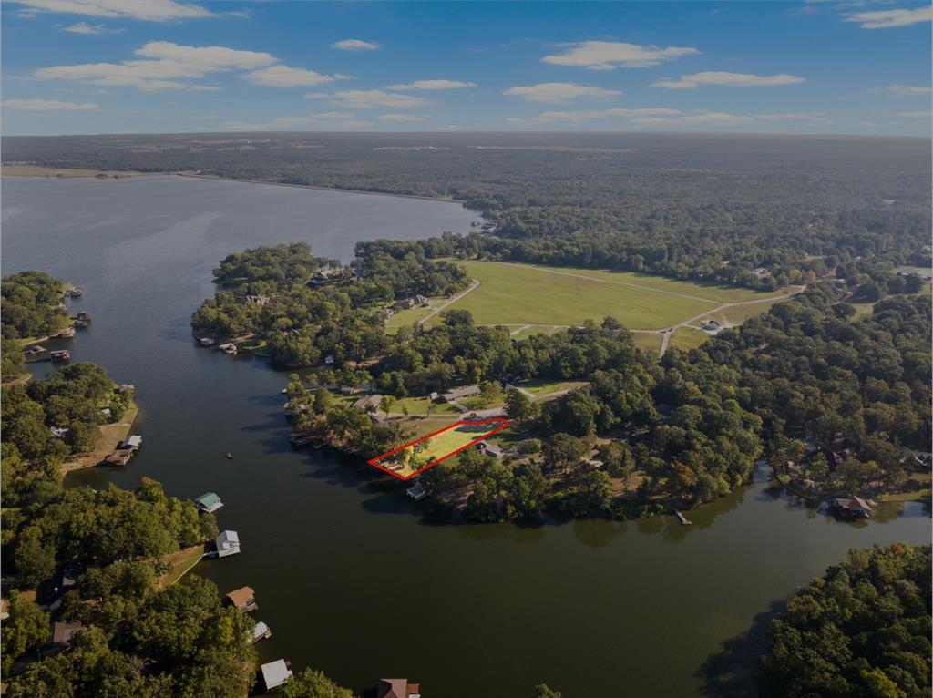 Welcome to your dream oasis on Lake Bob Sandlin! Nestled on nearly 1 acre of picturesque landscape in the prestigious Meadowlake Estates, this property offers unparalleled tranquility and stunning lake views. The perfect blend of privacy and convenience, this prime location is ideal for building your dream home. Imagine waking up to the gentle sounds of the lake and ending your day watching breathtaking sunsets over the water. Don't miss this rare opportunity to own a piece of paradise in one of the most coveted communities. Live the life you've always imagined at this beautiful lakeside property!