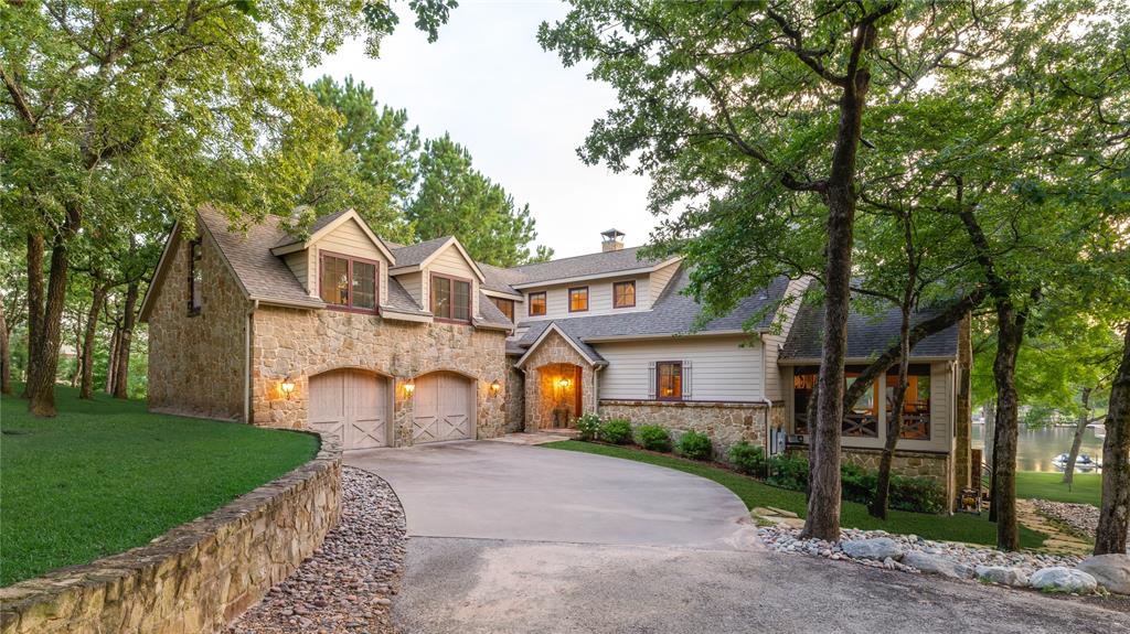 This Lake Athens retreat is a stunning 5-bedroom, 4-bathroom lake house that blends the warmth of a rustic lodge with the comforts of modern living. Set on a one-acre wooded lot, this property offers the perfect balance of seclusion and accessibility, creating a true lakefront escape. The home is set just off the main body of Lake Athens, providing an excellent spot for water recreation on big water, while its location in an oversized protected cove makes it equally ideal for stand-up paddle boarding, kayaking, and peaceful mornings by the water. Inside, the home’s character is highlighted by lodge-style touches, generous living spaces, and room for family and guests alike. With five bedrooms and four bathrooms, it’s designed for entertaining, relaxing, and enjoying life on the lake. A whole house generator gives peace of mind and assurance you'll never be without power. Whether you’re seeking an adventurous weekend getaway or a full-time lakefront residence, 3540 Pleasant Run offers both the privacy of a wooded setting and the beauty of Lake Athens living.
