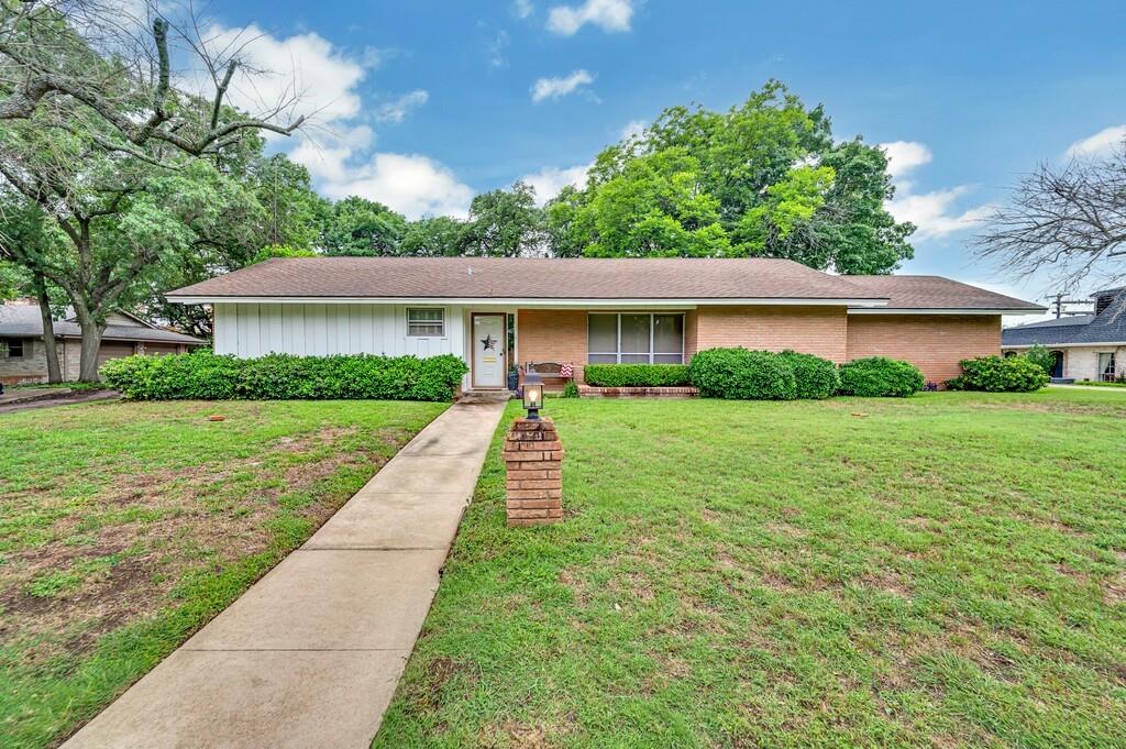 This well-maintained 4-bedroom, 2-bath home built by Joe B. Allen, offers 2,239 square feet of living space on a beautiful lot. Built in 1960, this home features timeless character with modern conveniences. The spacious living room includes a gas log brick fireplace, built-in bookshelves, and opens to the formal dining area, creating a warm and inviting space for entertaining. The kitchen offers a freestanding range, vent hood, dishwasher, and a cozy breakfast area with bay windows and plantation shutters that overlook the backyard. The primary bedroom features plantation shutters and an en-suite bath with a tub and shower combo. Three generously sized guest bedrooms that share a full guest bath with a walk-in shower. A spa room located off one of the back bedrooms includes sliding glass doors and large windows, offering a relaxing retreat with views of the outdoors. Additional features include a rear-facing two-car garage and a spacious backyard shaded by mature trees, perfect for outdoor enjoyment. Don’t miss this wonderful opportunity to own a classic home in an established neighborhood with great curb appeal and comfortable living spaces. $294000