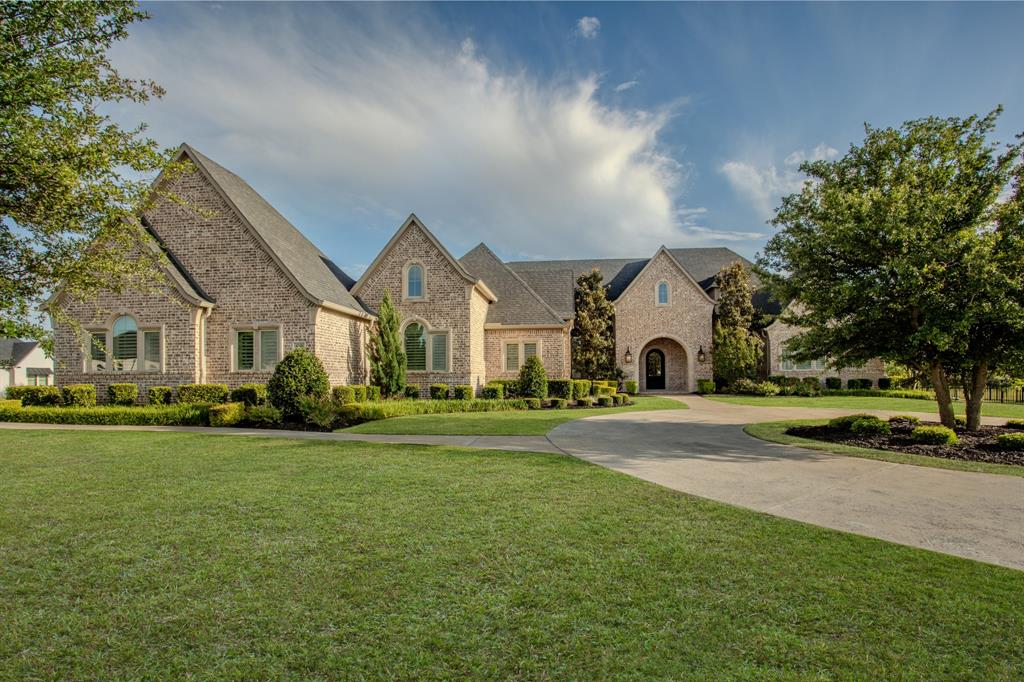 Experience refined living in this exceptional Dave R. Williams custom home, formerly the builder’s model, located in the exclusive gated community of Christie Farms. Perfectly positioned on a sprawling one-acre homesite, this residence showcases impeccable craftsmanship, thoughtful design, and a seamless blend of sophistication and comfort.
Designed for both everyday living and elevated entertaining, the home offers 5 spacious bedrooms, 6 luxurious baths, and a 4-car garage—all thoughtfully arranged on a single level for effortless flow. The expansive floor plan features a private office, along with a spacious game room and fully equipped media room, both enhanced with custom built-ins that add functionality, style, and a polished, designer finish.
At the heart of the home, the chef’s kitchen is both striking and functional—featuring an oversized island, premium appliances, custom cabinetry, and an abundance of prep and storage space. Designed to impress, it opens seamlessly to the main living and dining areas, creating the perfect environment for hosting while maintaining an intimate, connected feel.
The living experience extends outdoors to a covered back patio designed for true indoor-outdoor living. Complete with built-in screens, this space offers year-round comfort and flexibility—perfect for al fresco dining, relaxed evenings, or elevated entertaining. Overlooking the expansive one-acre homesite, the outdoor setting provides both privacy and the opportunity to create a true resort-style retreat.
From the moment you enter, you are met with elevated finishes, designer details, and true model-home quality throughout. Set within the prestigious Christie Farms community, known for its estate-sized lots and serene surroundings, this property offers both privacy and presence—delivering a luxury lifestyle in one of Prosper’s most sought-after enclaves.