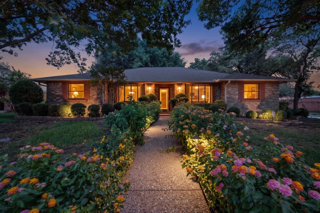 Charming Custom-Built Brick Home Backing to Townsend Park! This beautifully maintained, one-owner home showcases the craftsmanship of a bygone era, featuring real wood construction and custom-built cabinetry crafted on. Situated on a desirable corner lot, the home offers exceptional curb appeal with mature trees. Inside, you'll find a bright formal dining room adjacent to the spacious living area, perfect for entertaining. A versatile sunroom provides additional living space with tile flooring and direct access to the fully fenced backyard. The private primary suite features separate vanities and a generous walk-in closet. Secondary bedrooms offer abundant space and ample storage. The attached two-car garage is accessible from the alley and opens to the driveway. Backing directly to Townsend Park and just moments from Ernie Roberts Park and the Roy Orr Trail, this home provides a unique blend of privacy and convenience. Enjoy quick access to shopping, schools, and major highways—just minutes from I-35 and approximately 16 minutes from Downtown Dallas and the Bishop Arts District. Information deemed reliable but not guaranteed. Buyer and buyer's agent to verify all information, including measurements, schools, taxes, and property condition.