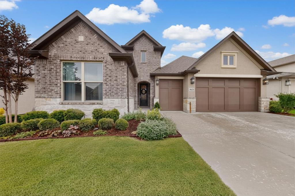 This beautifully designed Weston model blends timeless farmhouse charm with everyday functionality, all set within the highly sought-after active adult community of Robson Ranch. With its brick, stucco, and stone exterior, lush landscaping, and golf cart garage, the home offers standout curb appeal from the moment you arrive.

Inside, warm wood-look tile flows through the main living areas, complemented by crown molding and soft carpeting in the bedrooms. The kitchen is both stylish and practical, featuring crisp white cabinetry, granite countertops, a gas range, stainless steel appliances and sink, and a spacious walk-in pantry—perfect for entertaining or everyday living. The inviting living room is highlighted by a tray ceiling, while the dining area provides ample space and access to the patio.

The primary bedroom offers a relaxing retreat, complete with a tray ceiling and an ensuite bath featuring linen storage, a walk-in shower with built-in seating, and a walk-in closet. Guests will appreciate their own private space with an ensuite bath and tub shower combination, while the dedicated office with French doors provides flexibility for work or hobbies. Don't forget the utility room: built-in counters and cabinetry adds convenience.

Step outside to an extended covered patio surrounded by privacy landscaping and a fenced yard—ideal for enjoying quiet mornings or evening gatherings.

Beyond the home, residents of Robson Ranch Denton enjoy a vibrant resort-style lifestyle with championship golf, pickleball and tennis courts, fitness centers, indoor and outdoor pools, scenic walking trails, on-site dining, and a full calendar of clubs, classes, and social events.

This is more than a home—it’s a lifestyle designed for connection, comfort, and active living.