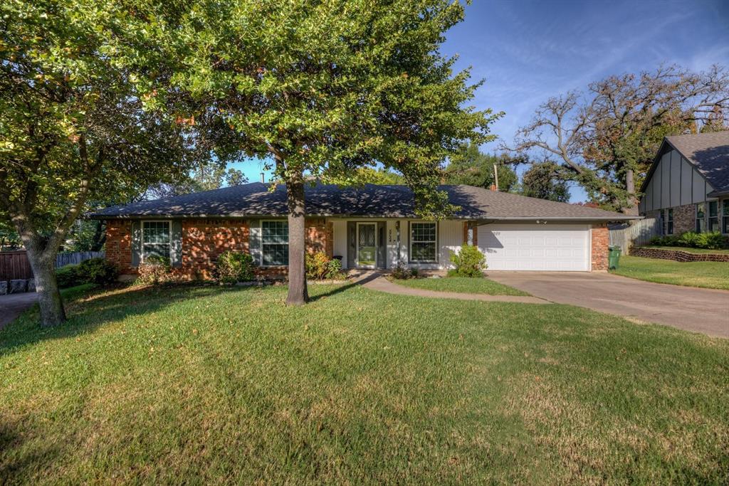 Welcome to this charming 3-bed, 2-bath haven! The front yard with a covered porch sets a natural tone. Inside, a well-designed mix of laminate, ceramic tiles, and carpet spans the home. The kitchen is a highlight, featuring quartz countertops, modern backsplash, built-in cabinets, and essential appliances. Enjoy meals in the eat-in kitchen or entertain in the formal dining room. The living room is bathed in natural light, complemented by a cozy fireplace. The master bedroom has its own stylish bathroom, while two additional bedrooms share a second full bathroom. A sunroom and separate utility room add extra appeal. The wood-fenced backyard provides a private and serene outdoor space. Park effortlessly in the single-door garage. Welcome to your new home! All Westrom Group residents are enrolled in our RESIDENT BENEFIT PACKAGE (RBP). Please view our website for more details.