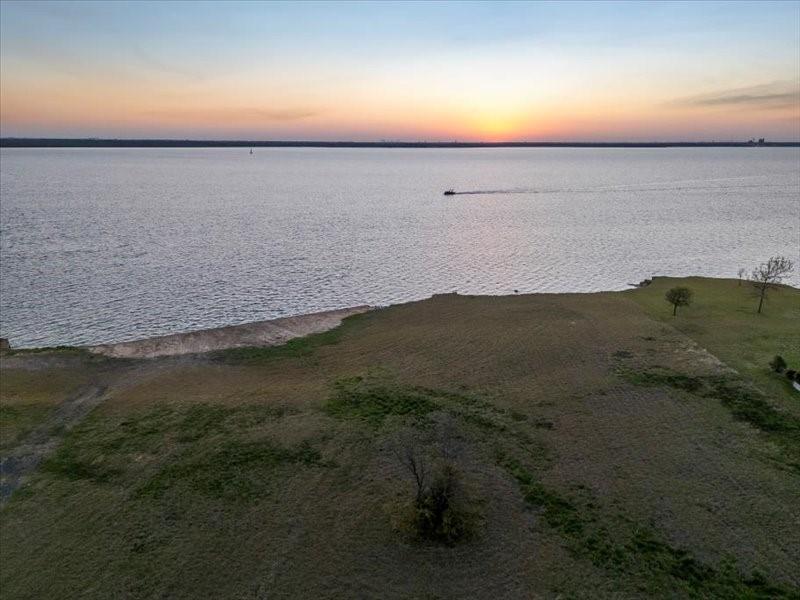 Discover the perfect sunset at 1534 Hubbard Drive in the highly coveted Heath, Texas. This over 1.88 acre lakefront property provides the extremely rare opportunity to design your own premier lakefront estate in Heath, Texas. This enormous lot provides an extraordinary canvas to build a custom, dream home that seamlessly blends elegance, privacy, and waterside living in a single location. At 1534 Hubbard Drive, you will enjoy unobstructed views across Lake Ray Hubbard while being on one of the last remaining luxury lakefront estates.

This property is ideal for someone who is seeking a private, prestigious lakefront estate with room to build an expansive custom home for entertaining friends and family, while also serving as a retreat for relaxation. It is within walking distance to Heath Golf and Yacht Club, a premier 18-hole private golf course, and less than 25 miles from downtown Dallas. This is one of the few remaining oversized vacant lakefront properties left on Lake Ray Hubbard.

Seize this rare opportunity to craft a luxury lakefront estate in Heath, Texas. Please contact us for a private lot tour.