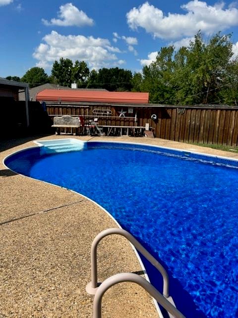 You just found 'THE ONE'.  USDA eligible, USDA loan requires no do down payment.  Darling Drive Up Appeal. Over a Third of an Acre Lot. Front Door Opens to the view of the Pool and Into the Cozy Living Room with Wood Burning Fireplace and Plank Flooring added 2017 is Open to Kitchen, Updated and Ready to move in.  Black and White Secondary Bedroom flooring just completed Sept 2023. Kitchen features Stainless Steel, Farm Sink, and Granite. Bathrooms have been Beautifully Updated. Light Fixtures updated - the work has already been done for you.  Refreshing pool, New Liner July 2021, Covered Patio, Deck, and Charming Covered Front Porch is perfect for Rocking Chairs!  Roof Sept 2017, 15 Seer HVAC replaced Dec 2022, Schools are within walking distance.