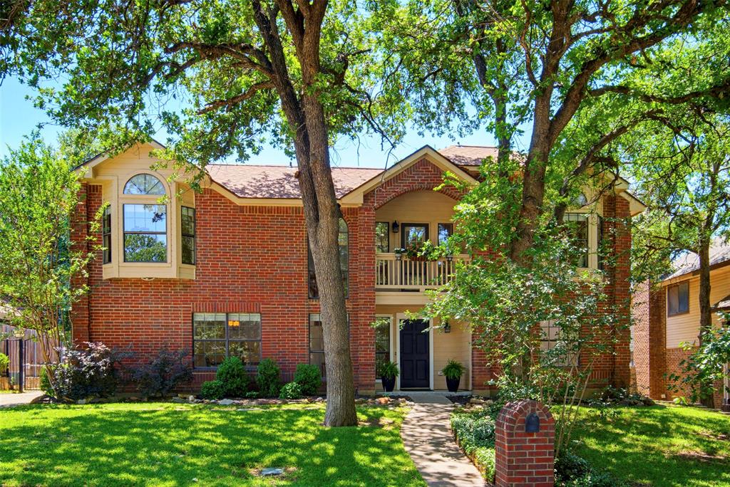 Two blocks to Lake Arlington. Martin High School district. Easy access to I-20 & Highway 287. Two-story brick home sitting elevated on the street. Mature trees anchoring the lot. Traditional architecture with bronze & iron finishes threading throughout, the kind of aesthetic that ages with character instead of chasing trends. Walk in & the great room commands attention. Wood burning fireplace as centerpiece. Wood paneling walls painted but still delivering dimension & depth. Dry bar ready for evening pours. Room flowing naturally into the kitchen, open sightlines without losing definition. Kitchen built for gathering. Custom wood cabinetry. Granite countertops. Stainless appliances. Large layout with breakfast bar doubling as homework island. Space for friends perched with wine while you prep. Dedicated breakfast nook overlooking the mature treed backyard through windows framing green space. Half bath downstairs so guests stay in common zones. Primary suite downstairs. Huge bedroom with vaulted ceilings stretching overhead. Room for seating area if desired. Primary bath with dual sinks. Separate tub & shower. Three bedrooms upstairs. Tall ceilings throughout. Serious storage capacity. Dedicated full bath serving the second floor. Balcony cantilevering over the front door, built for evening air. Systems & infrastructure recently upgraded. Roof replaced. HVAC system replaced. Water heater replaced. Garage doors replaced. Gutters replaced. All window screens replaced, Fiber Optic Installed. The mechanicals handled so you don't have to. Backyard delivers space & shade. Mature trees providing natural canopy. Patio shaded by established growth. Shed handling tools, storage, overflow. Room to breathe. Shorewood Estates positioning. Two blocks to Park & Lake Arlington for trails, water access, green space. Martin HS district. I-20 & 287 connecting Fort Worth, Dallas, Mid-Cities. Traditional layout with finishes that hold. Lake proximity. Arlington address with space.