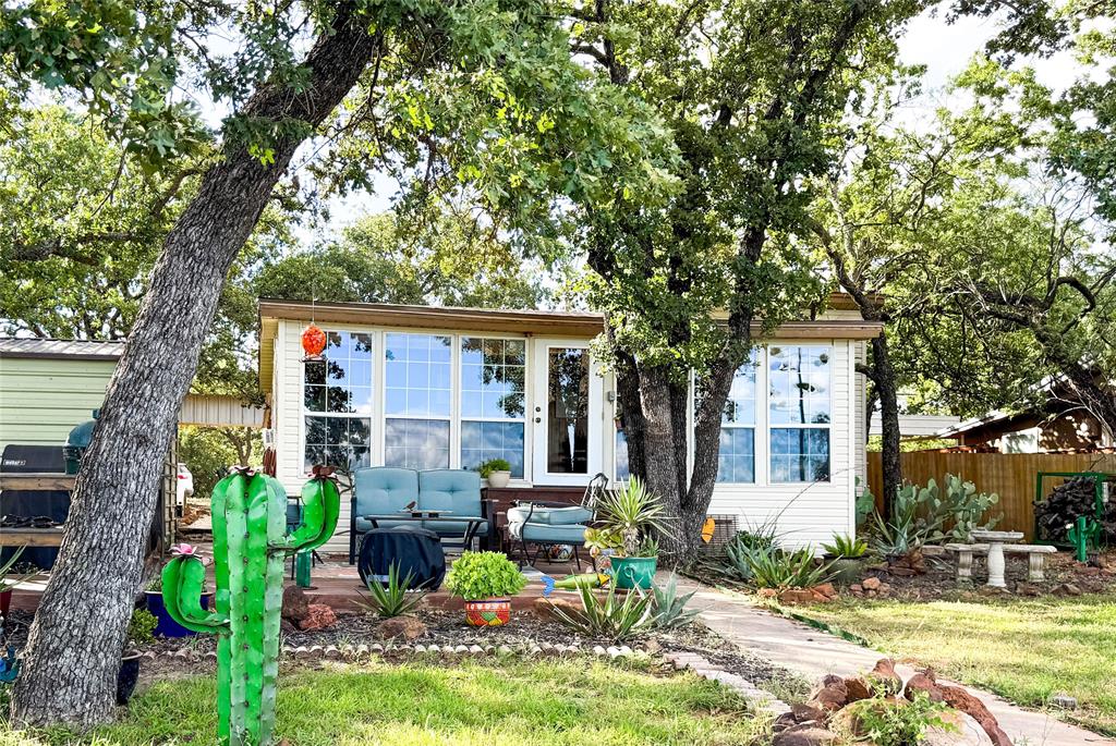 Oh, the Views!
Don’t miss this desirable waterfront 2-bedroom, 2-bath home on Lake Cisco, perfectly positioned with panoramic views—the dam to your left and the Point to your right. The living room’s floor-to-ceiling windows invite you to soak in the breathtaking sunsets that paint the lake each evening.
Relax on the dock, watch the gentle waves roll by, or cast a line and enjoy some peaceful fishing. Ready for more adventure? Take a scenic ride around Lake Cisco — because yes, the BOAT IS INCLUDED!
Whether you’re looking for a vacation retreat, weekend getaway, or full-time lake home, this property delivers it all. With a brand-new roof (April 2025) and fresh new light beige siding, it’s move-in ready and beautifully maintained.
From the sparkling water to the unforgettable sunsets, this picture-perfect lakeside paradise will truly take your breath away.
Note: Lot is leased from the City of Cisco.