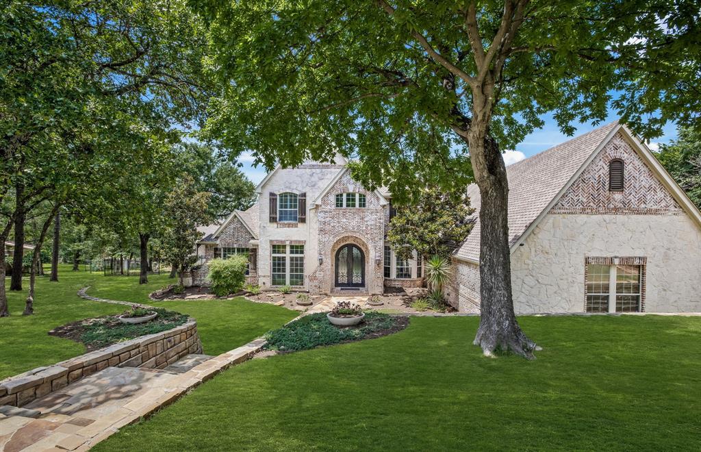 Gorgeous property set in the woods on private 1.15 acre cul de sac lot in Southlake & minutes to Lake Grapevine. This custom home features 6,108 sqft., 5 beds, 5 baths, a media rm, game rm, several living areas, outdoor living & guest quarters. The thoughtfully designed open floor plan is ideal for both family living & entertaining, w a Chef's kitchen open to the great rm w walls of windows w views of the covered back patio, gorgeous pool, outdoor kitchen, & expansive backyard. The downstairs primary suite is a true retreat, featuring a convenient coffee bar & a stunning bath w large closet, separate dressing rm & dual vanities. Additional guest bed, sitting rm, exercise or playroom, pool bath, utility rm, library or office & formal dining complete the first floor. Upstairs features 3 add beds, a game rm & large media rm. The outdoors is where this home really shines offering a covered patio, pool & spa, outdoor living area & kitchen, 1,165 sqft. guest quarters & incredible yard space.