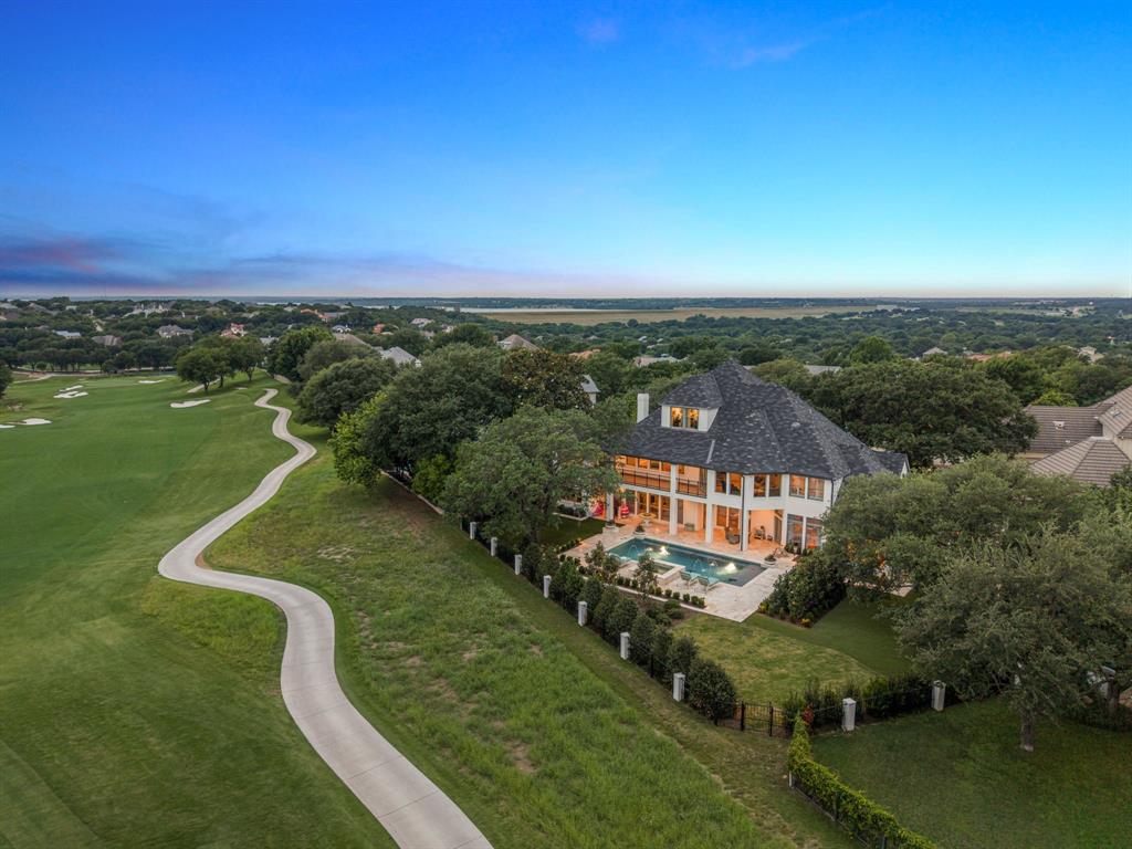 Set within the guarded gates of Mira Vista, 6605 Sahalee Drive is a commanding West Fort Worth estate where scale, luxury, and livability converge across an extraordinary 7,005 square feet. Recently transformed through an extensive renovation in which virtually every room has been thoughtfully reimagined, this six-bedroom, six-bath residence delivers a rare blend of modern refinement and resort-style comfort.

From the moment you enter, the home showcases elevated design through rich new flooring, curated lighting, fresh paint and texture, upgraded technology systems, and beautifully refreshed interiors tailored for both grand entertaining and everyday living. Designed with an emphasis on flexibility and lifestyle, the residence unfolds across three stories of livable space featuring an impressive collection of family and living areas, a dedicated music room, and dynamic spaces that create an unmatched experience for families seeking both sophistication and functionality.

Walls of windows frame sweeping golf course views while seamlessly connecting the interiors to the home’s exceptional outdoor setting. A heated pool and spa anchor the backyard retreat, complemented by expansive covered patios and terraces designed for year-round enjoyment overlooking the meticulously maintained grounds.

With three covered garage spaces, an ideal Mira Vista location, and an extensive list of updates already completed, 6605 Sahalee Drive represents a rare opportunity to own a fully revitalized luxury estate within one of Fort Worth’s most prestigious gated golf course communities.