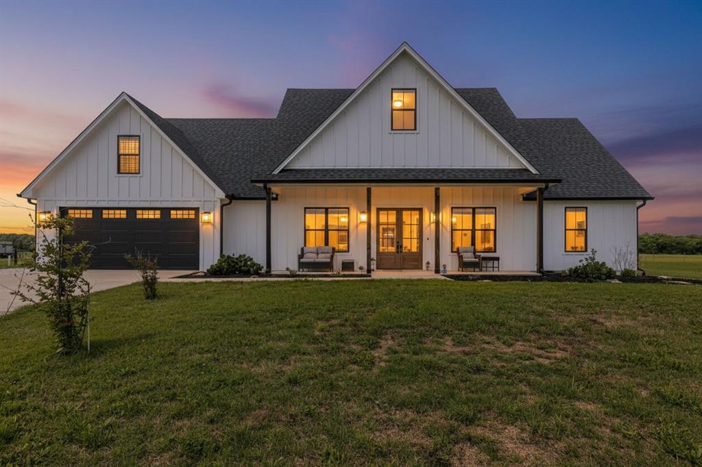 Welcome to 289 E Bell Rd in Gholson—where modern farmhouse design meets wide-open Texas living on 12.54 beautiful acres. Built in 2023 by BAM Builders, this custom home offers 2,928 sqft of thoughtfully designed space, blending high-end finishes with everyday functionality. Inside, the open-concept layout is anchored by soaring vaulted ceilings, exposed beams, and custom cabinetry throughout. The kitchen is a true showpiece, featuring a massive granite island, gas range with pot filler, custom open shelving, and a dedicated coffee bar nook. An oversized walk-in pantry keeps everything organized and clutter-free, while a hidden office nook provides a perfect work-from-home setup.The isolated primary suite is a private retreat, complete with sliding barn doors, a beautiful garden tub, dual vanities, and a spacious walk-in closet. Upstairs, a versatile bonus room with its own half bath offers flexibility as a fourth bedroom, media room, or creative space. Additional highlights include a large laundry room with abundant storage and a fully finished garage featuring a custom dog kennel and built-in dog wash station. Step outside and enjoy the best of country living with a large covered patio, complete with a fireplace and mounted TV—perfect for relaxing or entertaining. The property also features a gazebo, greenhouse, and custom metal planter boxes for those who love to grow their own food. A stocked tank with catfish and minnows adds to the charm and functionality of the land. For those needing workspace or storage, the massive custom metal shop is a standout, offering two huge oversized bays and a covered RV pad with full hookups. A plumbed shower and bathroom inside the shop makes this space capable of being its own living space. A lofted area can double as more storage or even a future apartment living space. The acreage can be mowed for hay and the low property taxes makes this home an ideal spot for your and your family to enjoy the Texas countryside