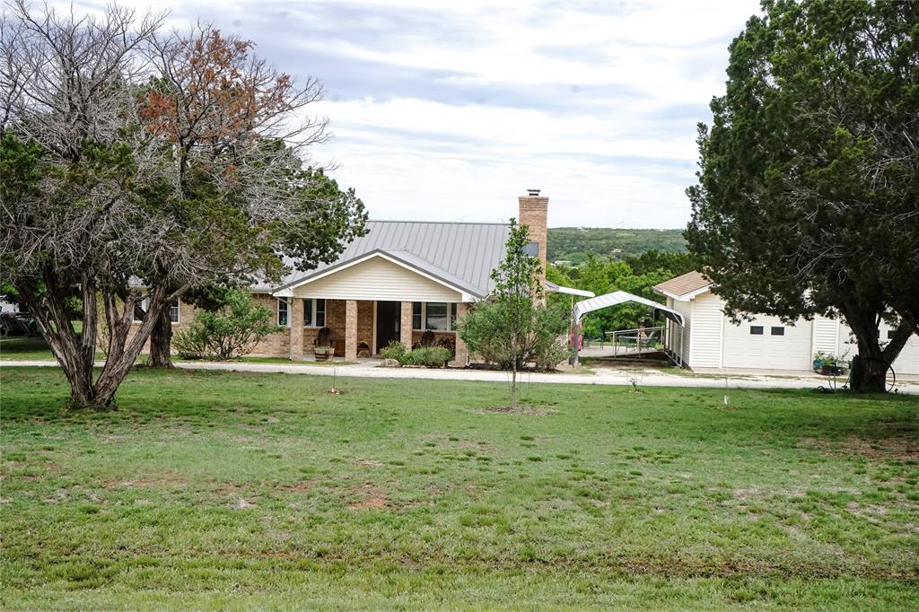 Welcome to your slice of Texas paradise in the highly sought-after Deer Mountain Estates, located within Jim Ned ISD! This beautifully maintained 3-bedroom, 2-bath home offers 2,093 square feet of comfortable living space, perfectly situated on 2 acres with breathtaking views that truly set this property apart. Step inside to find a warm and inviting living area featuring custom built-ins and a cozy fireplace—perfect for relaxing or entertaining. The spacious layout offers comfort and functionality, with a jetted tub featured for a spa-like experience.

Outside, the property continues to impress with a detached 2-car garage, additional outbuildings, and carport—providing plenty of room for storage, hobbies, or workspace. The beautifully landscaped grounds enhance the natural beauty of the property, creating a peaceful retreat with wide-open Texas views, all while being just a short drive from Abilene.

If you’ve been searching for space, views, and a well-cared-for home in Jim Ned ISD—this is it. Homes like this do not come along often and will not last long!