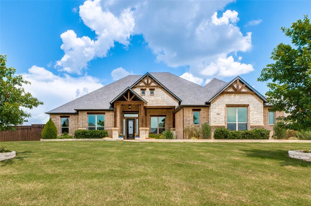 SOLAR PANELS & GENERAC TOTAL HOUSE GENERATOR REMAIN! Beautiful luxury home on 1.03-acre lot in the serene Horseshoe Meadows community, zoned to Midlothian ISD (Heritage High). Energy-efficient upgrades include solar panels, attic foam insulation, tankless water heaters, and custom window film, resulting in low utility costs. Thoughtfully designed with 4 bedrooms, 3 baths, a private office, and a versatile downstairs bonus-flex room with wet bar and beverage frig for added living space. Open-concept living showcases hand-scraped wood floors, soaring ceilings, abundant natural light, and designer finishes. The gourmet kitchen is a chef’s dream with a large island, granite countertops, a 5-burner gas cooktop, double ovens, a walk-in pantry, and extensive custom soft-close cabinetry. Adjacent dining flows into the impressive living room featuring a 12-foot ceiling with exposed beams and a floor-to-ceiling stone gas-log fireplace. Luxurious primary suite offers a private retreat with a spa-inspired ensuite: a soaking tub and a walk-through shower with dual showerheads. Large secondary bedrooms, two of which are pre-wired for flat-screen TVs, provide comfort and flexibility. Outdoor living is exceptional: a large covered outdoor patio with a wood-burning fireplace, a TV in a cabinet above the fireplace, and a gas outlet for connecting to a grill. Beautiful in-ground pool with expansive surrounding decks, perfect for entertaining, plus an above-ground hot tub. Property also includes an oversized 3-car garage with overhead storage, a 12 ft x 12 ft storage shed on a concrete pad, an underground propane tank, full sod and irrigation with dedicated tree bubblers. Exceptional combination of space, style, energy efficiency, and thoughtful design — ready to welcome you home. See the home features list in the MLS documents!