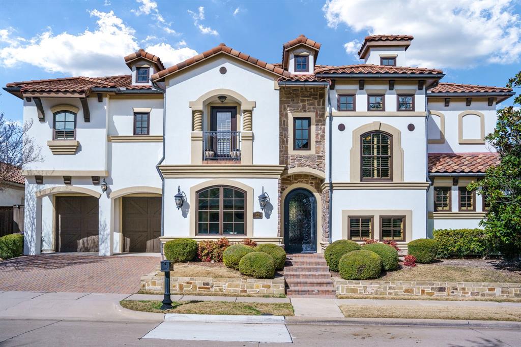 Spanish-inspired luxury in the heart of West Plano, just minutes from Legacy West and The Shops at Legacy. This elegant residence offers 4 bedrooms and 4.5 baths, with every bedroom featuring a private ensuite, delivering a rare level of comfort and privacy that sets this home apart from others in the area. Timeless architectural details create an immediate sense of character, including arched doorways, stone accents, rich hardwood flooring, soaring ceilings, and designer lighting throughout. Unlike typical homes that simply check boxes, this home is designed to create a lifestyle—blending everyday living with elevated entertaining. The layout features a formal dining room, inviting wine parlor, and expansive living spaces centered around a chef’s kitchen with generous prep space and premium Viking gas cooking. Upstairs, flexible living continues with a spacious game room, media room, wet bar, and dedicated office—ideal for entertaining, working from home, or accommodating multi-generational needs. A dedicated gym space adds modern versatility and can easily convert to a tandem 3-car garage, expanded laundry, or additional flex space, ensuring the home adapts with your lifestyle over time. Step outside to a covered patio designed for year-round enjoyment, creating the perfect setting to relax or host guests. Located in one of West Plano’s most desirable communities near major corporate campuses, luxury dining, shopping, and entertainment, this home offers more than just a place to live—it offers a connected, high-end lifestyle. With its rare combination of private ensuite bedrooms, entertainer’s layout, architectural character, and unbeatable location, this is a home that stands out from the competition and delivers lasting value in today’s market.