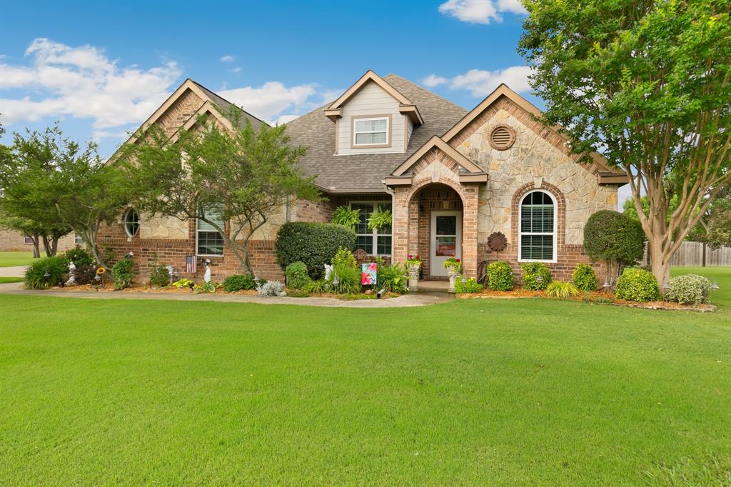 Stunning brick and stone home on over 1 acre in prestigious neighborhood with 4 bedrooms, 3.5 baths, recessed lighting, neutral paint, built-ins, 10 ft ceilings, 2 in blinds & crown molding, brick gas fireplace in living room can be converted back to wood if desired! Kitchen with granite counters, gas range, breakfast bar, SS appliances, tile backsplash and ample cabinets and pantry! Master bath boasts oversized spa-like shower and walk-in closet! All bedrooms down. Upstairs Game Room! Huge backyard with room for both and pool and a pole barn and more!! Covered flagstone patio and electric screens for a bug-free summer!  10x20 shed , with lawn and garden equipment incentive!! 8x8 greenhouse stays and there is an 18x18 fenced garden! Outdoor cooking area and patio furniture. 220 Amp Service for future hot tub, etc. New windows (2016-2017) Statewide Remodeling, Roof in 2024 with Simmons Roofing, New Lowes fridge and stove 2025, 2017 new heat and air with ARS, 22024 new hot water heaters with ARS, wood fireplace converted to gas, newer microwave 2017 and dishwasher 2018, included refrigerator in garage from Lowes 2017.