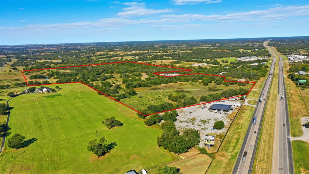 94 ± acres in Decatur on Highway 287. This is an absolutely beautiful tract, with many hardwood trees and 2 ponds. This property is currently not in the City Limits, and is in AG. It has the potential to be turned into an amazing horse property, or luxury homestead. It also has high development potential, being only 2 miles North of the 287 - 380 interchange and having roughly 450 feet of road frontage on the West side of Highway 287. This Northern corridor of 287 has many potential commercial applications, and is being utilized commercially by many other users. The seller of the property has received communication from TxDot, relating to the proposed expansion of this section of 287, which would result in easier access to the property via service roads. This would also likely increase traffic counts through this section of the Highway. If you would like further information about the property or regarding the future thoroughfare planning, please call the listing agent.