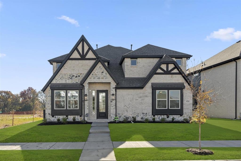 MLS# 20751062 - Built by First Texas Homes - Ready Now! ~ Step into an expansive floor plan featuring a chef’s kitchen with a large island, top-of-the-line stainless steel appliances, designer backsplash, wood hood, and butler’s pantry. The family room showcases an 18-foot flat ceiling, 5-foot linear fireplace, and sliding doors to the patio. A versatile downstairs bedroom doubles as a stylish home office. The private primary suite includes a spa-like bath with dual vanities, freestanding tub, separate shower, and walk-in closet. Upstairs offers four bedrooms, including an ensuite, plus a media room and game room with views of the family room below. This home perfectly blends beauty and functionality!