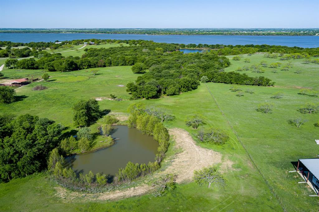 Don't miss this rare opportunity to own over 6 acres of beautiful raw land in one of Cooke County's most sought-after locations — Hemming Road. This stunning property offers natural beauty at every turn, featuring a mix of mature trees, a rolling landscape, and plenty of character, with a backdrop of Lake Ray Roberts. A picturesque pond and a seasonal creek add even more charm, making it the perfect setting for your dream home, a private retreat, or future investment. Enjoy the peace and privacy of country living, just minutes from the lake, with endless outdoor recreation opportunities. Properties like this are rare — schedule your tour today!