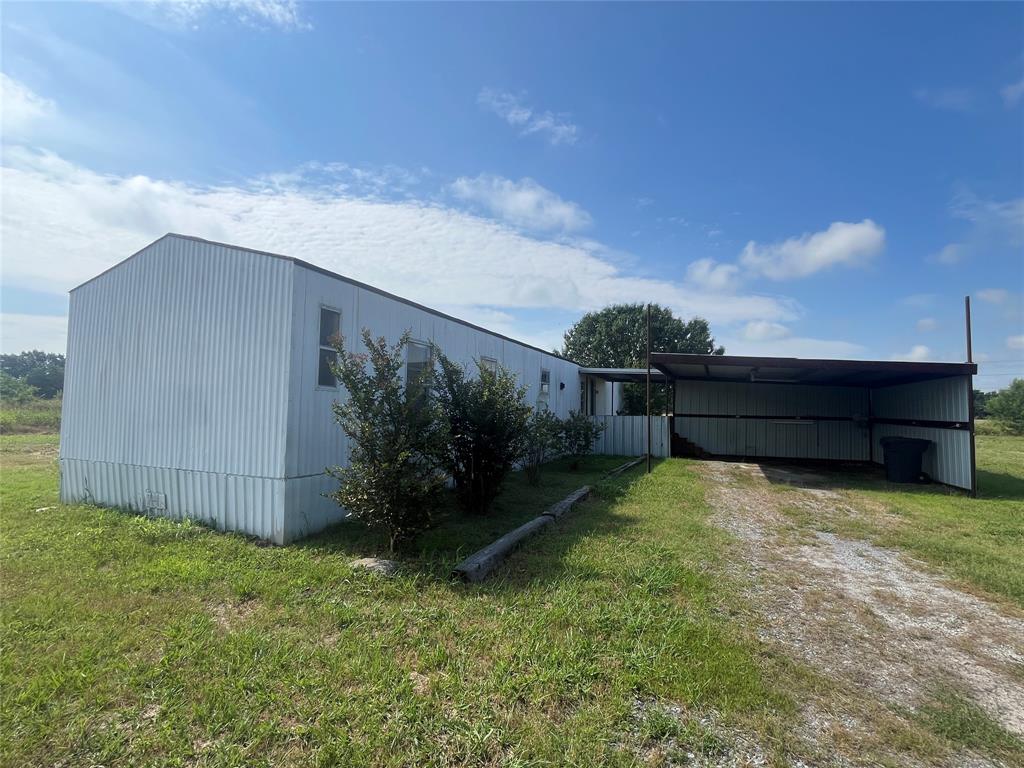 REDUCED INVESTMENT! Multiple mobiles! Discover the perfect country setting in Blue Ridge ISD, conveniently located near Hwy 82 and Hwy 380 for an easy commute into the Dallas area. This charming 3-bedroom, 2-bath mobile home sits on approximately 4.59 acres and features an oversized 2-car carport, a large covered front deck and open large back deck, and a spacious open-concept living, dining, and kitchen area. The kitchen is equipped with an eat-in breakfast bar, abundant cabinetry, and generous counter space. The split bedroom arrangement offers privacy, with the expansive primary suite boasting a large en-suite bathroom complete with a garden tub and separate shower. Large 30x40 metal building that needs some TLC, 12x12 shed in the back acreage and 2 additional single wide's-1 is apprx 12x56 and the other is 14x66-no utilities are installed yet on these but when completed they'll make perfect rentals! Property is fenced in the back and partially fenced up front. This property has great potential for the multi family needs or rental investment for a small mobile home park. Seller has engineer septic drawing proposal showing 6-7 additional mobiles and 4 more septic systems.