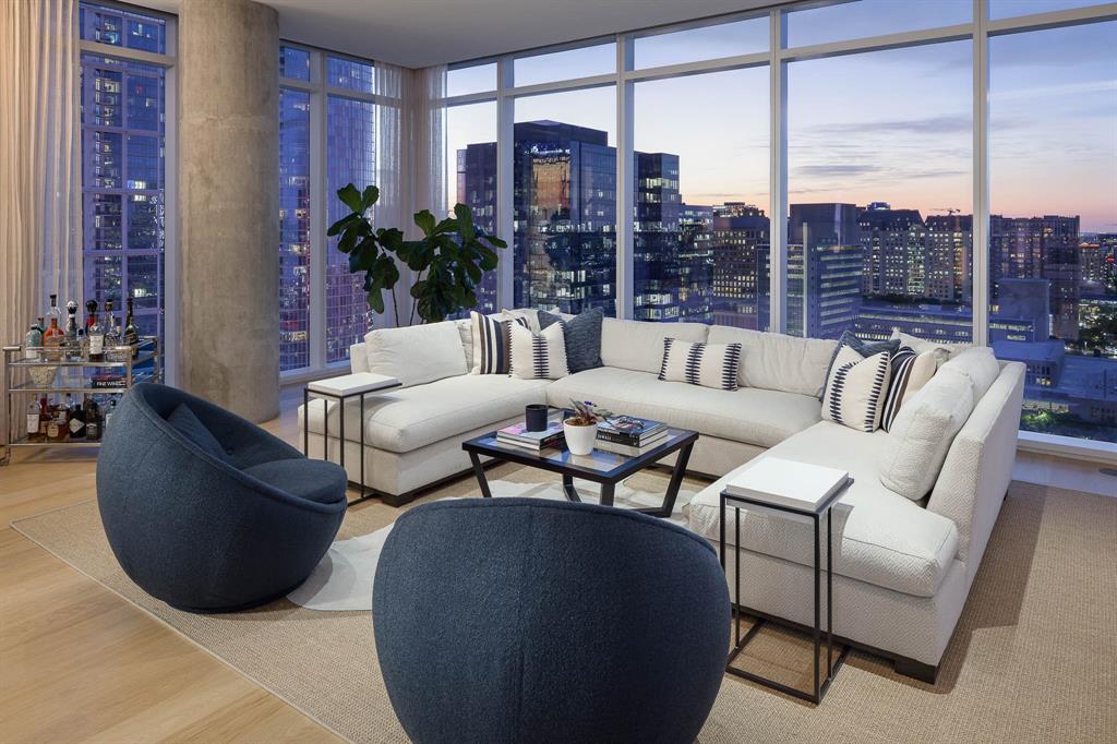 Thoughtfully reimagined condo at prestigious HALL Arts Residences. Superior craftsmanship and custom features, a gem in the heart of the vibrant Dallas Arts District. Floor to ceiling windows offer natural light. Den showcases hardwoods, dry bar, TV console. Great room with 270-degree skyline views. Kitchen boasts bulthaup cabinets, Gaggenau appliances, Insta Hot. Butler’s pantry allows a home office: SieMatic cabinets, coffee station, designer wallpaper, second dishwasher and sink. Sanctuary of a primary suite with hardwoods, his and hers California Closets. Refined powder room. Guest bedrooms: sisal carpeting, custom closets. Features: Custom drapery, Sonos AV System, power at the parking spots, wine refrigerator. A statement of luxury. Amenities: wine storage, treatment room, dining room, catering kitchen, pet spa, fitness room lap pool, spa, putting green, outdoor grill. Services: 24 7 concierge valet, house car, community events. HALL Arts Hotel partnership. 3 Parking. 1 Storage.