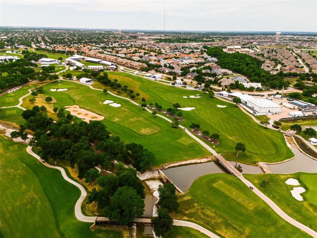 Behind the gates of TPC Craig Ranch, this extraordinary custom Mike Peckham estate blends architectural artistry, cutting-edge smart-home technology, and panoramic golf course living. Perfectly positioned along the fairways, the residence was designed for those who value elevated design, privacy, and effortless entertaining. 

Spanning approximately 4,265 square feet, the home offers 3 bedrooms, 3 full baths, 1 powder bath, a private study, elevator access to both levels, and seamless indoor-outdoor living spaces. From the moment you step through the handcrafted architectural glass doors by acclaimed artist Linda Lubinsky, every detail makes a statement - groin vaulted, barrel vaulted, and coffered ceilings, intricate hardwood and polished marble flooring with custom inlays, dramatic designer lighting, bespoke millwork, and a stunning marble staircase create an unforgettable first impression. 

The chef's kitchen features Sub-Zero refrigeration, a Wolf range, Viking double ovens, a built-in Scotsman ice system, oversized pantry, and custom soft-close cabinetry. Expansive living and dining areas open to a resort-style outdoor retreat complete with a covered lounge, fireplace, integrated television, outdoor kitchen with premium Lynx grill, fountain, pergola seating area, and breathtaking views overlooking TPC Craig Ranch. 

Luxury continues throughout with a library featuring a rolling ladder, custom built-ins, concealed storage, motorized shades and drapery systems, designer fireplaces, and a private primary suite offering a balcony overlooking the course, an expansive spa-inspired bath layout, oversized walk-in closets, and bespoke millwork. 

Fully integrated with a Control4 smart-home system, whole-home audio, enterprise-grade networking, security and surveillance, this residence also includes RainSoft water filtration, Toto Washlet smart toilets, central vacuum system, golf cart garage, and professionally designed landscaping.