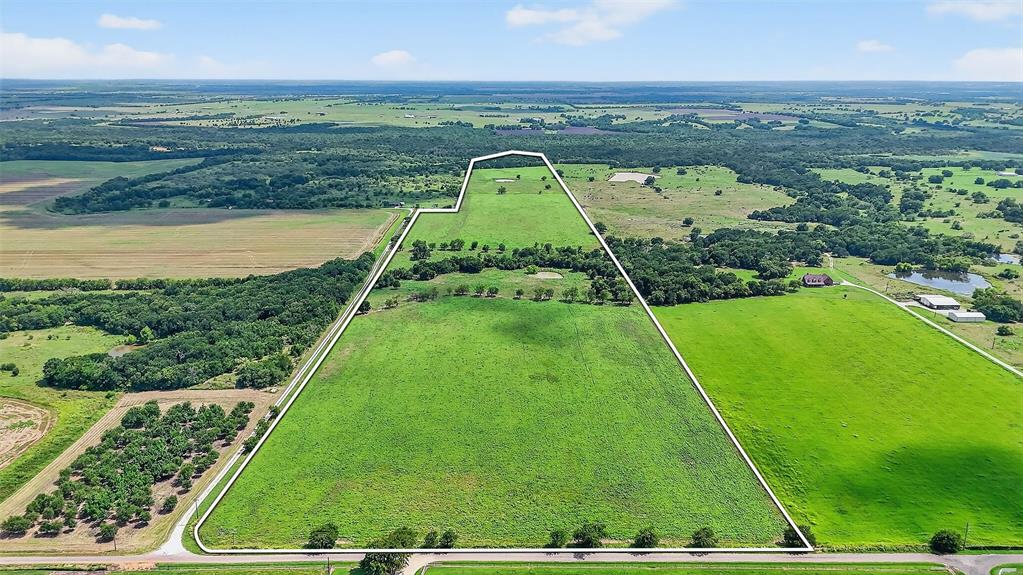 This beautiful 74 ac property includes two ponds, several pecan trees, and borders Corps of Engineers land along Range Creek at the southern end, which flows into Lake Ray Roberts. Wildlife is abundant, including whitetail deer, turkey, and feral hogs. Cattle are present on the property, so gates should remain closed. Located approximately 3.25 miles west of the proposed Dallas North Tollway extension into Grayson County, this property features around 740 feet of Hogtown Road frontage and extends nearly a mile deep to the south. Water and power lines run along Hogtown Road and Lewis Road, with a Two Way Special Utility District water meter situated near the east gate, about 1,000 feet south of Hogtown Road. The fencing on the north and east sides is less than two years old. This is a beautiful tract for a homesite and future development. Come out and let us show you around!