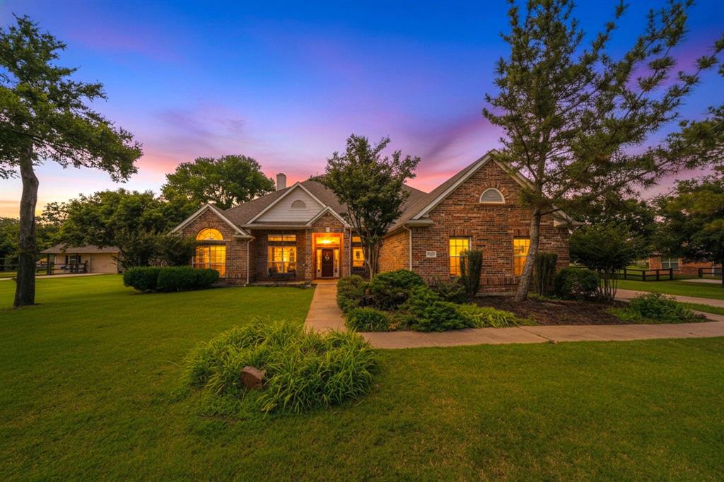Enjoy estate living in the country! NEW carpet May 2026! This pristine home in the desirable Lakeview Ranch is ready for move-in! Walls of windows everywhere offer an abundance of natural light and appealing views of the outdoors. A lovely covered front porch both welcomes you and has room for you to sit and watch the world go by. The wide tile entry hall opens to elegant formal dining on the right and an office with built-in bookcases & French doors on the left. Straight ahead is the great room with fireplace, which is open to the sunny breakfast room and spacious kitchen - ideal for entertaining crowds or just relaxing. The kitchen features an island, loads of counter & cabinet space, gleaming granite counters, and large pantry. To the right of the breakfast room is a flex room - perfect for workouts or second office. All bedrooms are downstairs with a 3-way split bedrooms, giving this home multi-generational possibilities. Primary bedroom has a private exit to the back patio; primary bath has jetted tub, separate shower & vanities and large closet. Two secondary bedrooms share a hall bath; 4th bedroom is near the kitchen on the other side of the house and has its own bathroom. This home includes a large utility room; a mud room large enough to be used as a crafts room; and a large game room upstairs with built-in desks and a bathroom. An additional half-bath is in the hallway off the great room. The side-entry 3-car garage includes a pull-down attic stair with plenty of storage in the attic. A fenced area in back is available for your garden or small pets. HVAC unit replaced in early 2026.